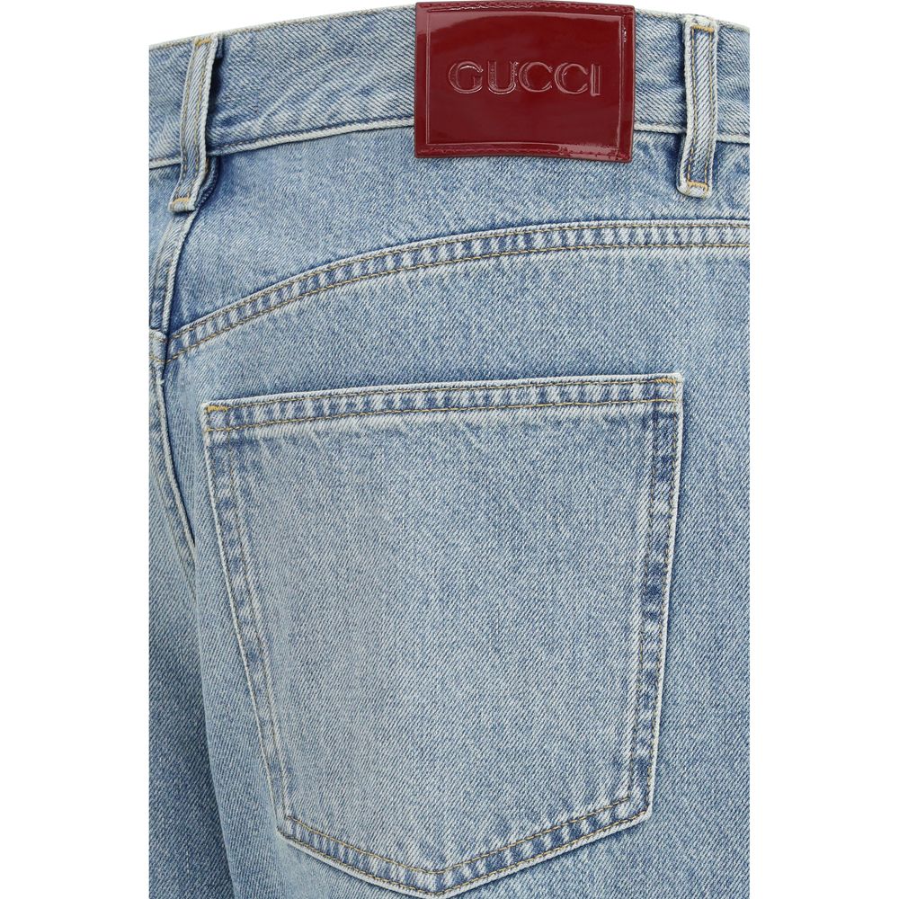 Jeans droits en coton bleu de Gucci, vue de face, avec détails de la coupe droite et finition classique.