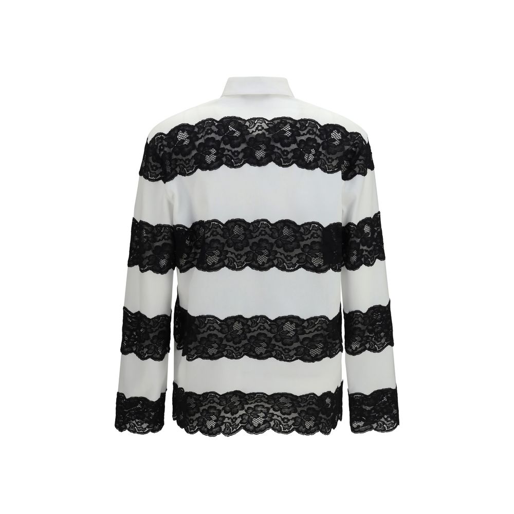 Chemise polo en coton blanc de Dolce & Gabbana, classique et élégante, avec col et boutons, pour un style sophistiqué.