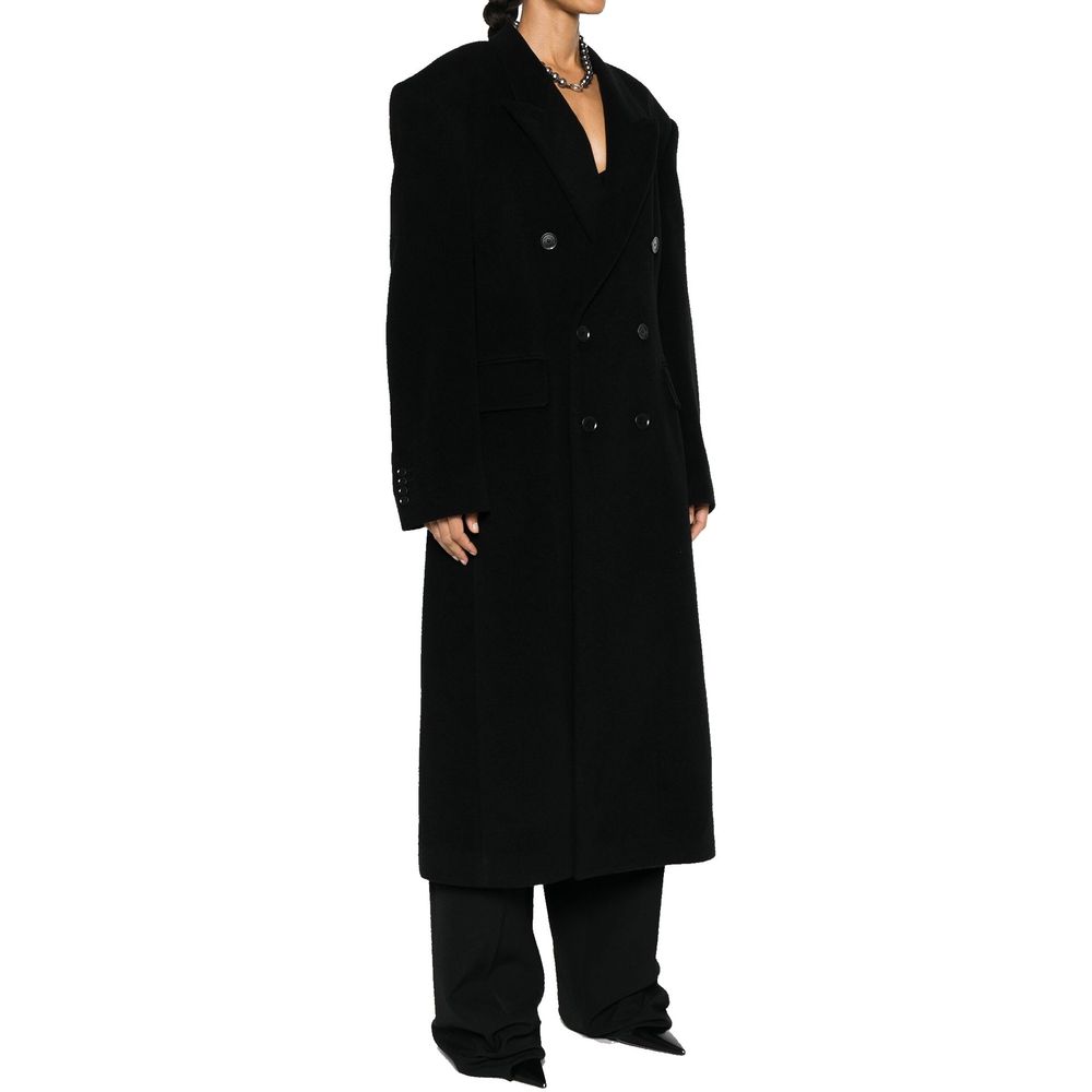Manteau en cachemire noir de Balenciaga, élégant et chaud avec coupe classique et détails sophistiqués.
