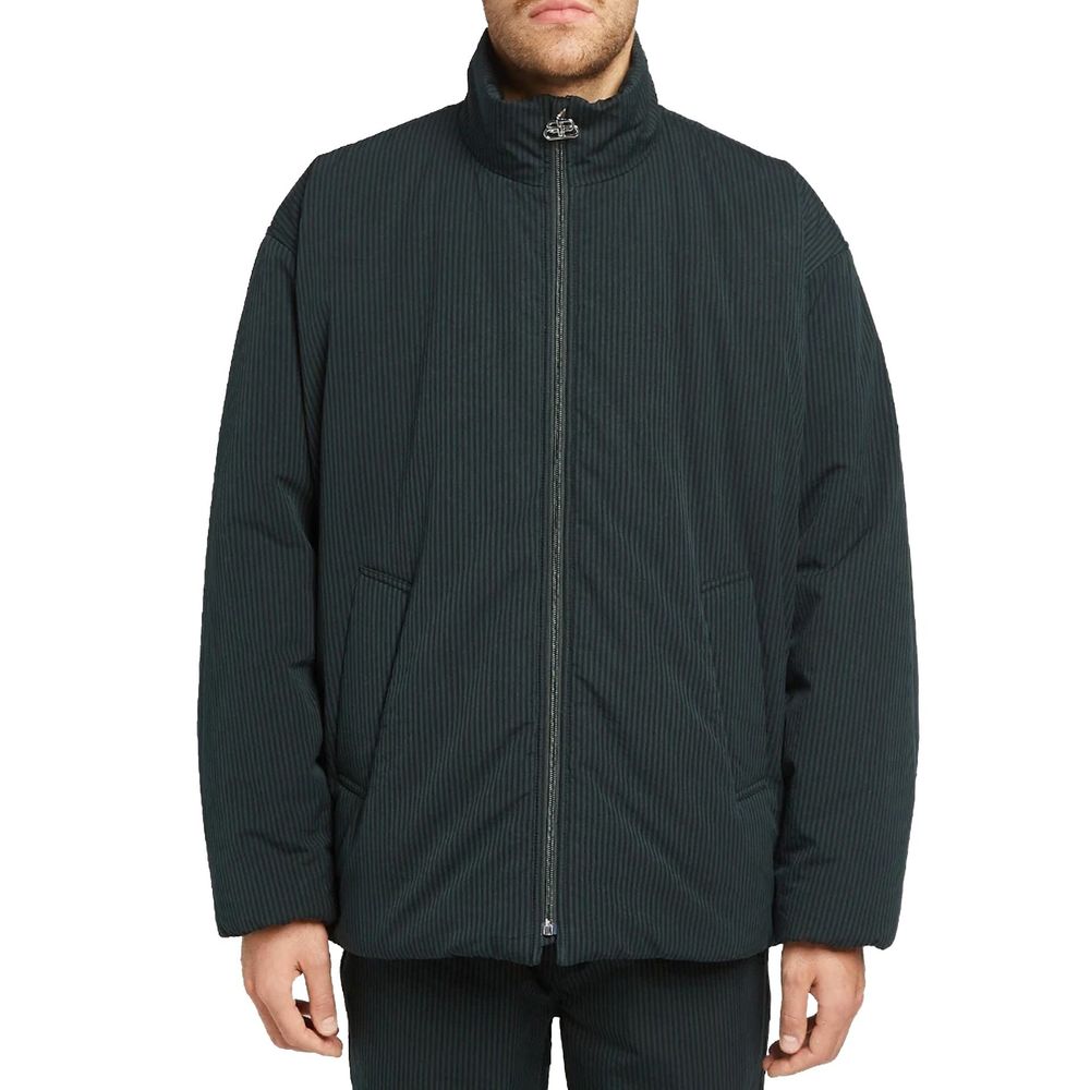 Veste longue en coton noir de Balenciaga, vue de face, avec fermeture à boutons et col classique.