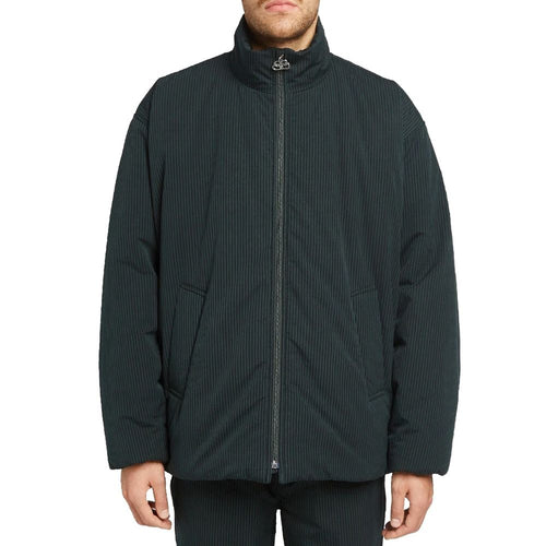 Veste longue en coton noir de Balenciaga, vue de face, avec fermeture à boutons et col classique.