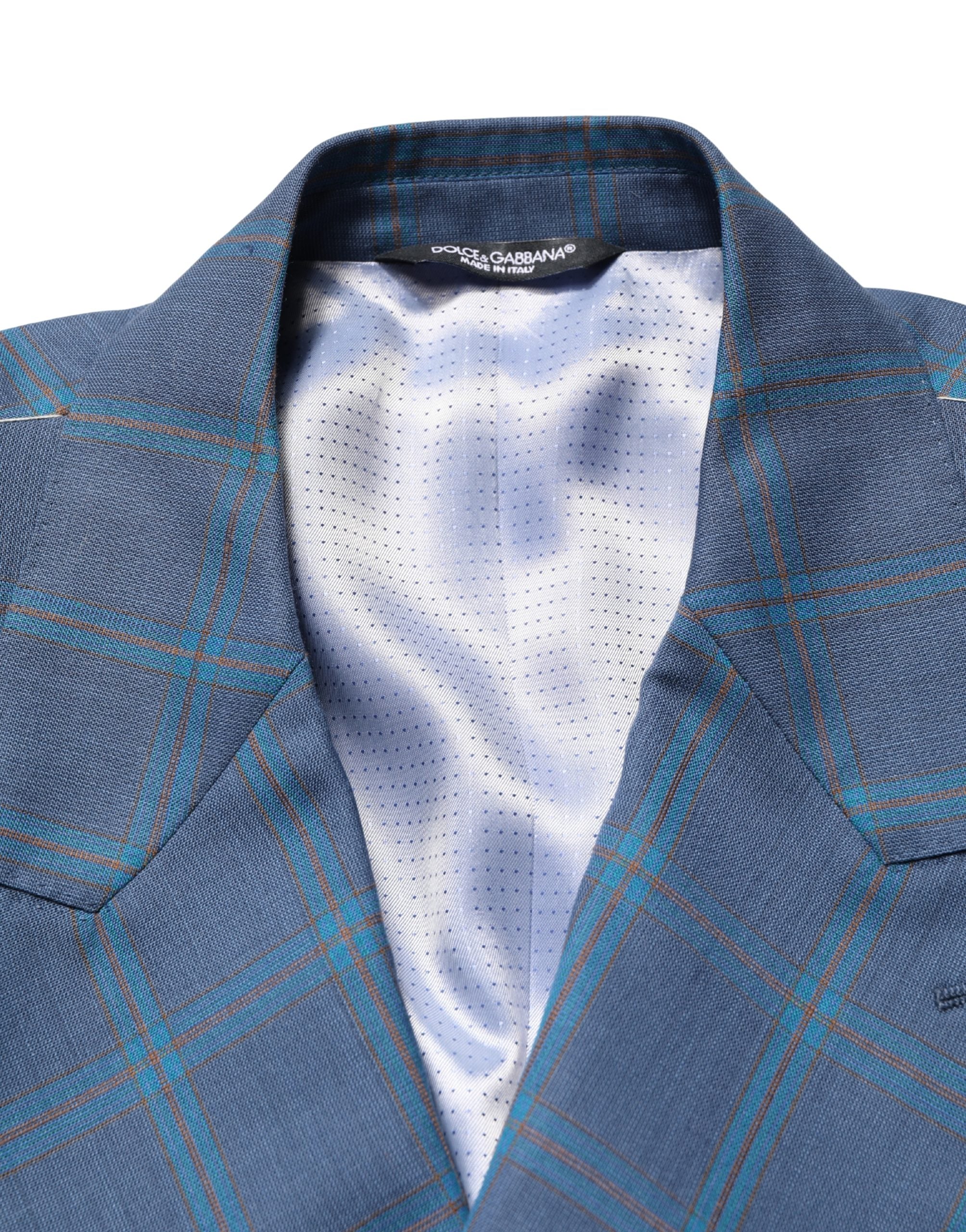 Costume homme Dolce & Gabbana à carreaux bleus, veste à double boutonnage élégante et classique.