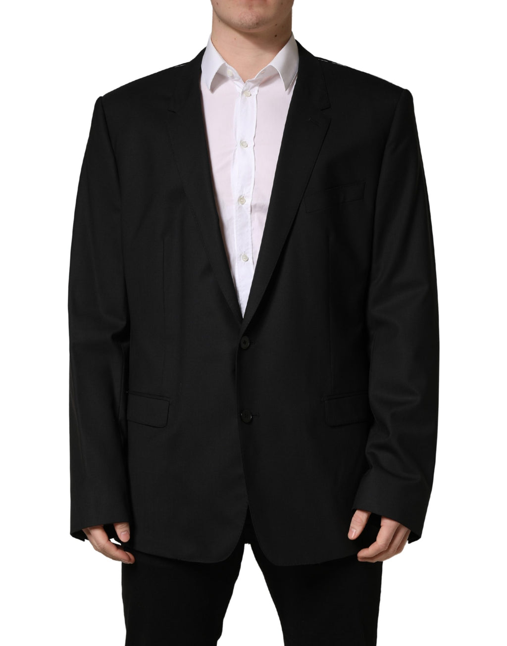 Costume noir Dolce & Gabbana, veste à deux boutons, coupe classique, en tissu élégant, portée formelle et sophistiquée.