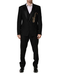 Costume homme Dolce & Gabbana en laine et soie noire, coupe slim, 3 pièces avec veste, pantalon et gilet, pour occasion élégante.