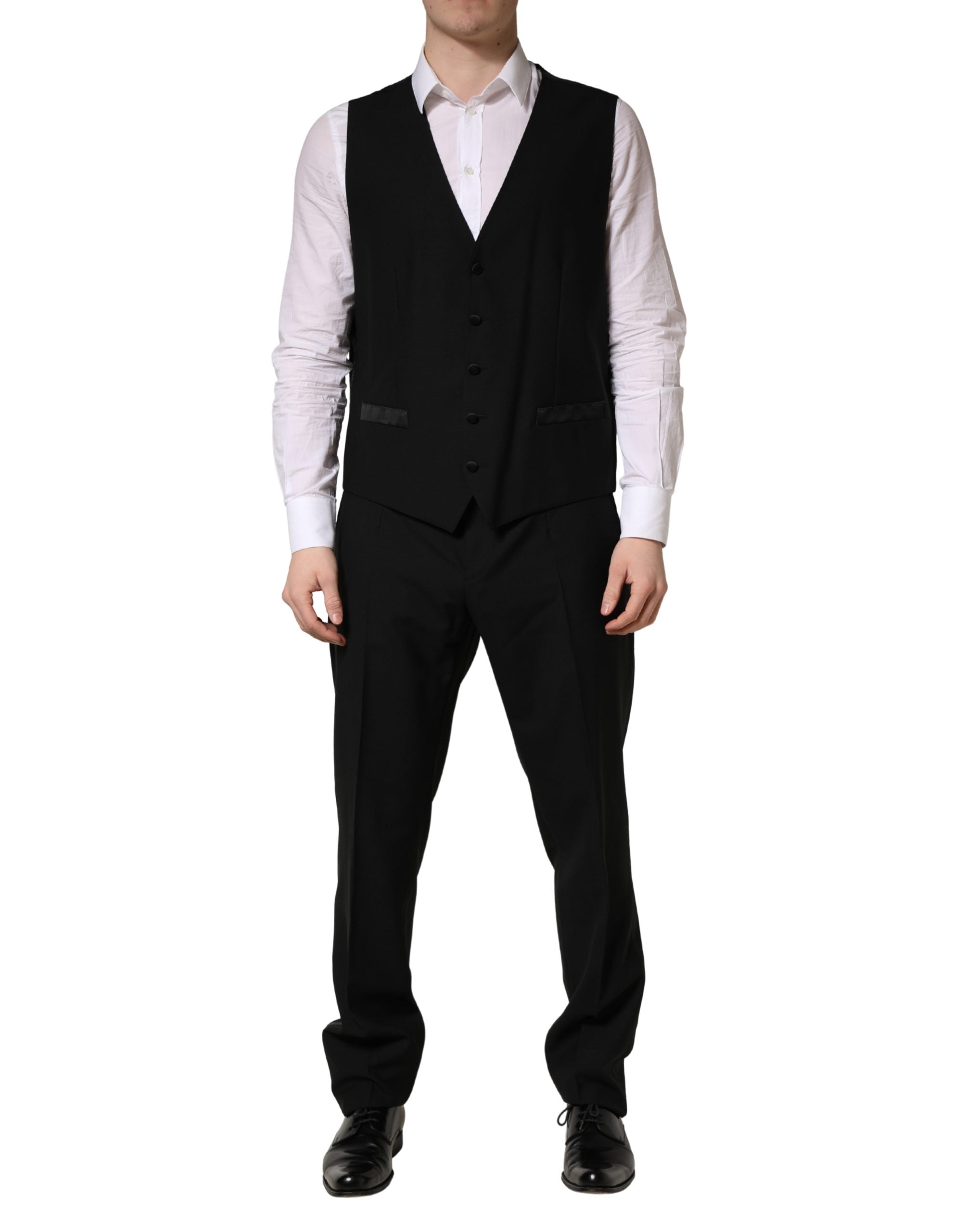 Costume trois pièces en laine et soie noire de Dolce & Gabbana, coupe slim fit, avec veste, pantalon et gilet.