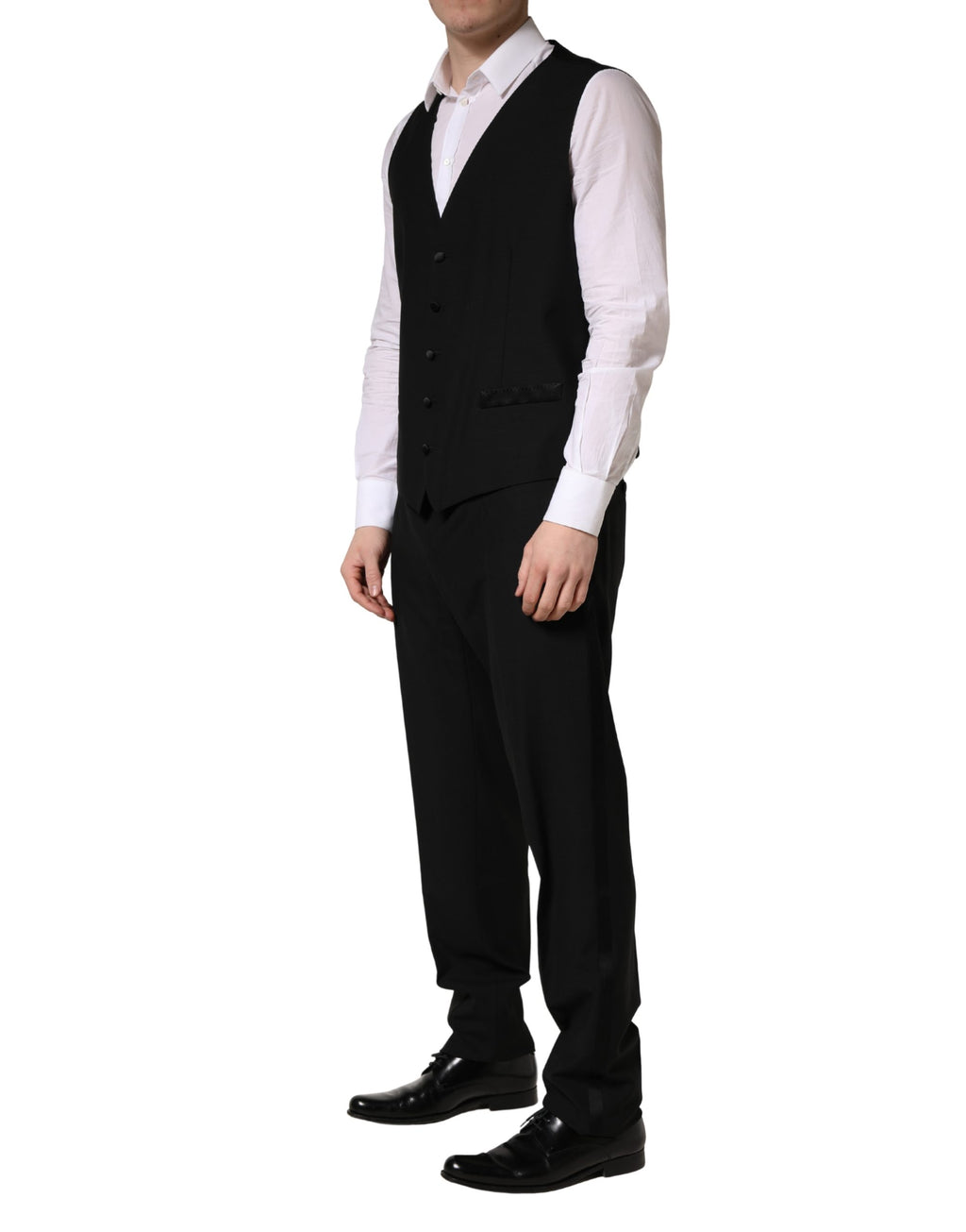 Costume trois pièces noir en laine et soie Dolce & Gabbana, costume slim fit avec veste, pantalon et gilet élégants.