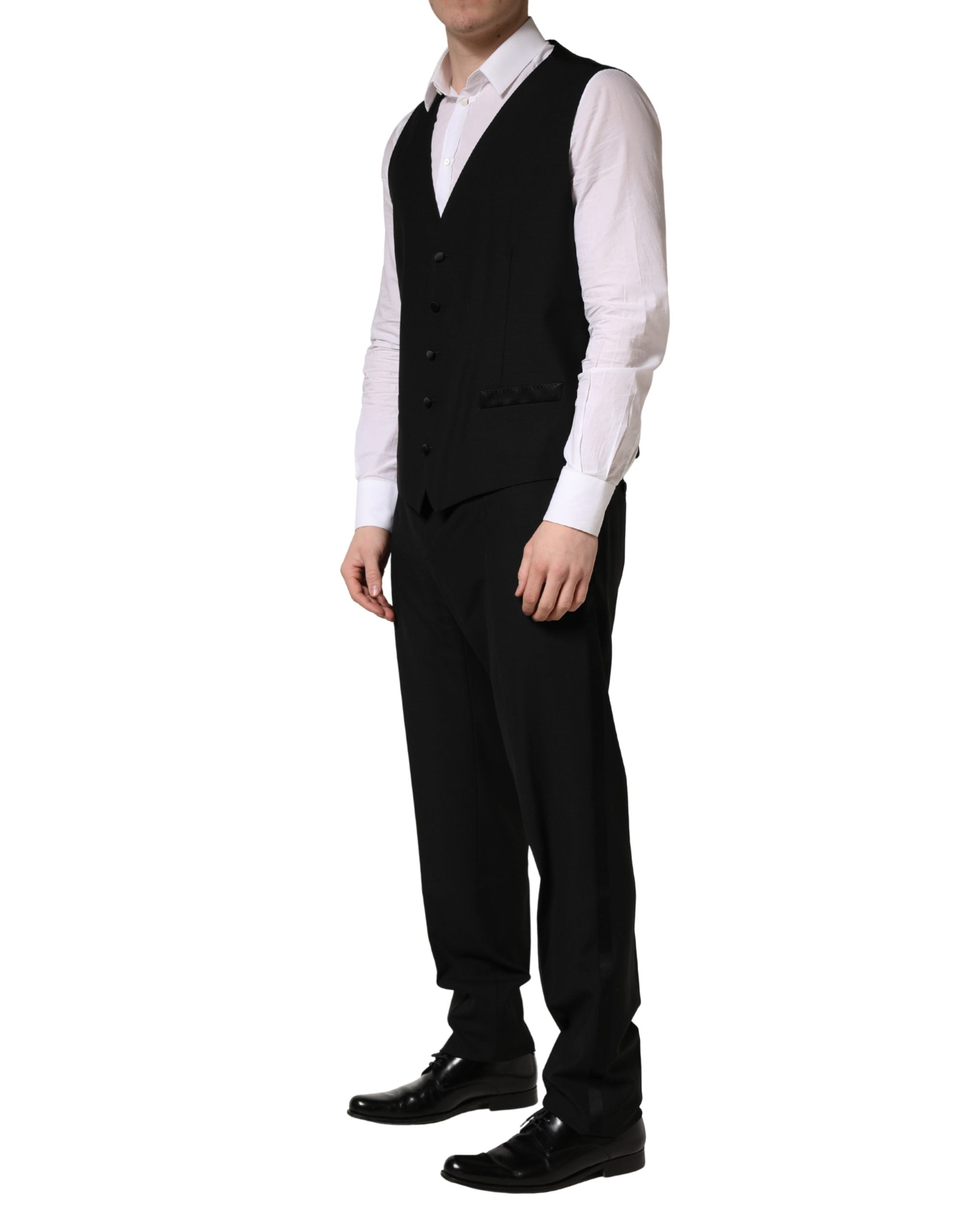 Costume trois pièces noir en laine et soie Dolce & Gabbana, costume slim fit avec veste, pantalon et gilet élégants.