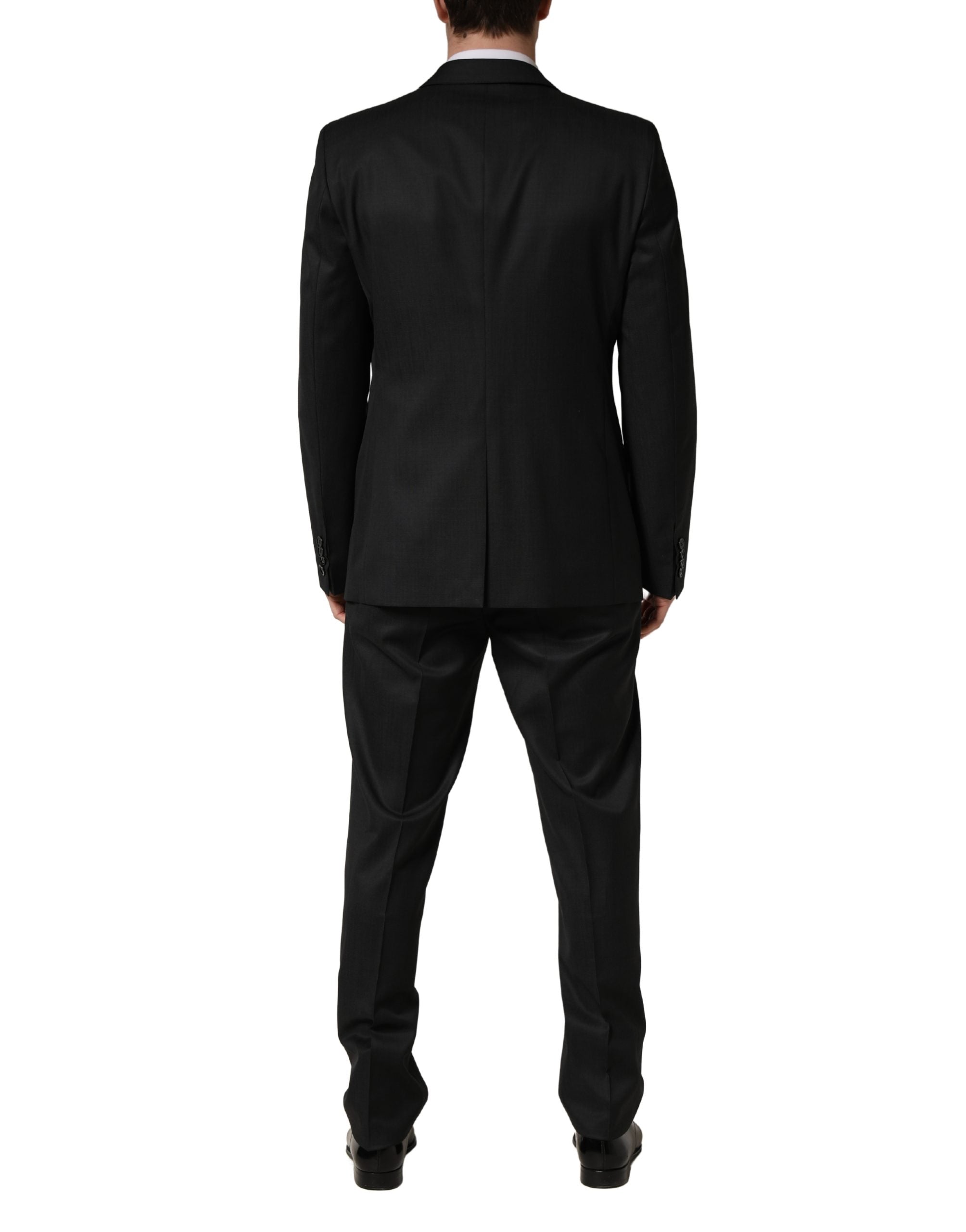Costume formel deux pièces en laine noire Dolce & Gabbana avec deux boutons, élégant et sophistiqué pour homme.
