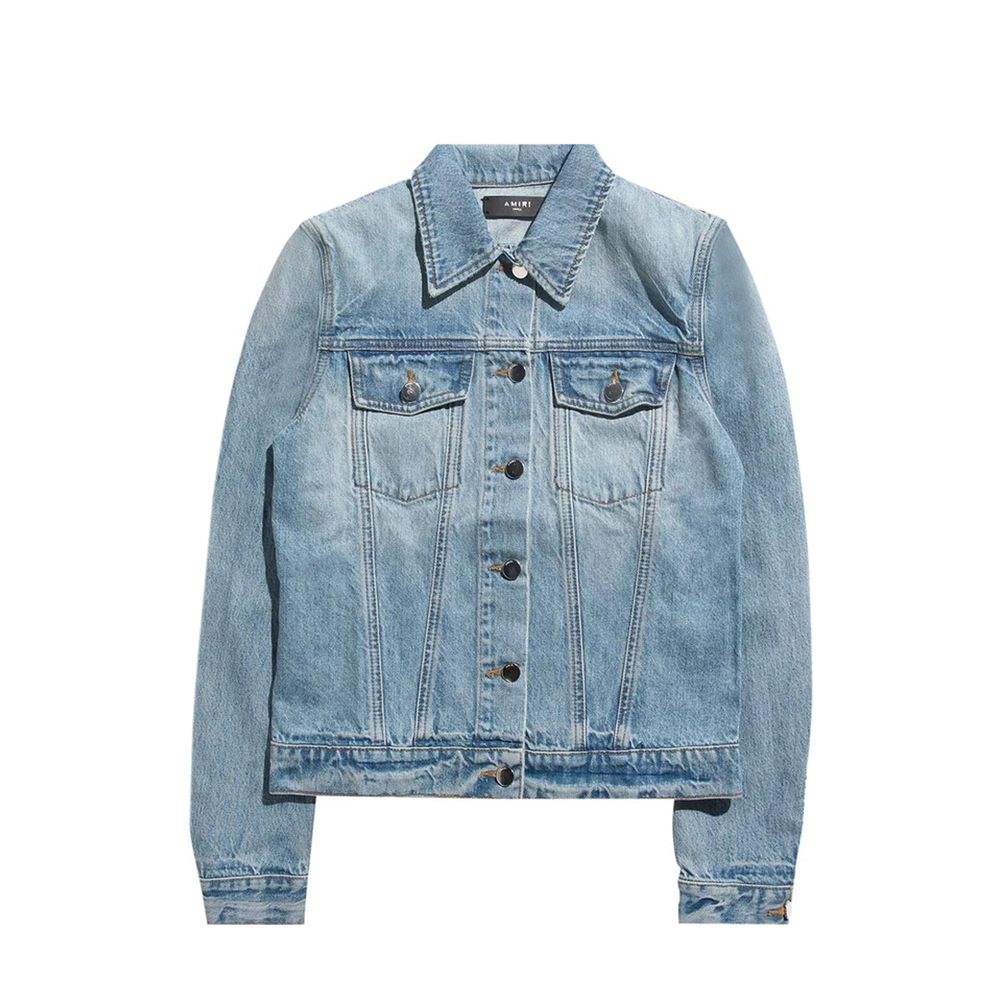 Veste en jean en coton bleu Amiri, coupe classique avec détails de couture visibles, portée sur un mannequin.