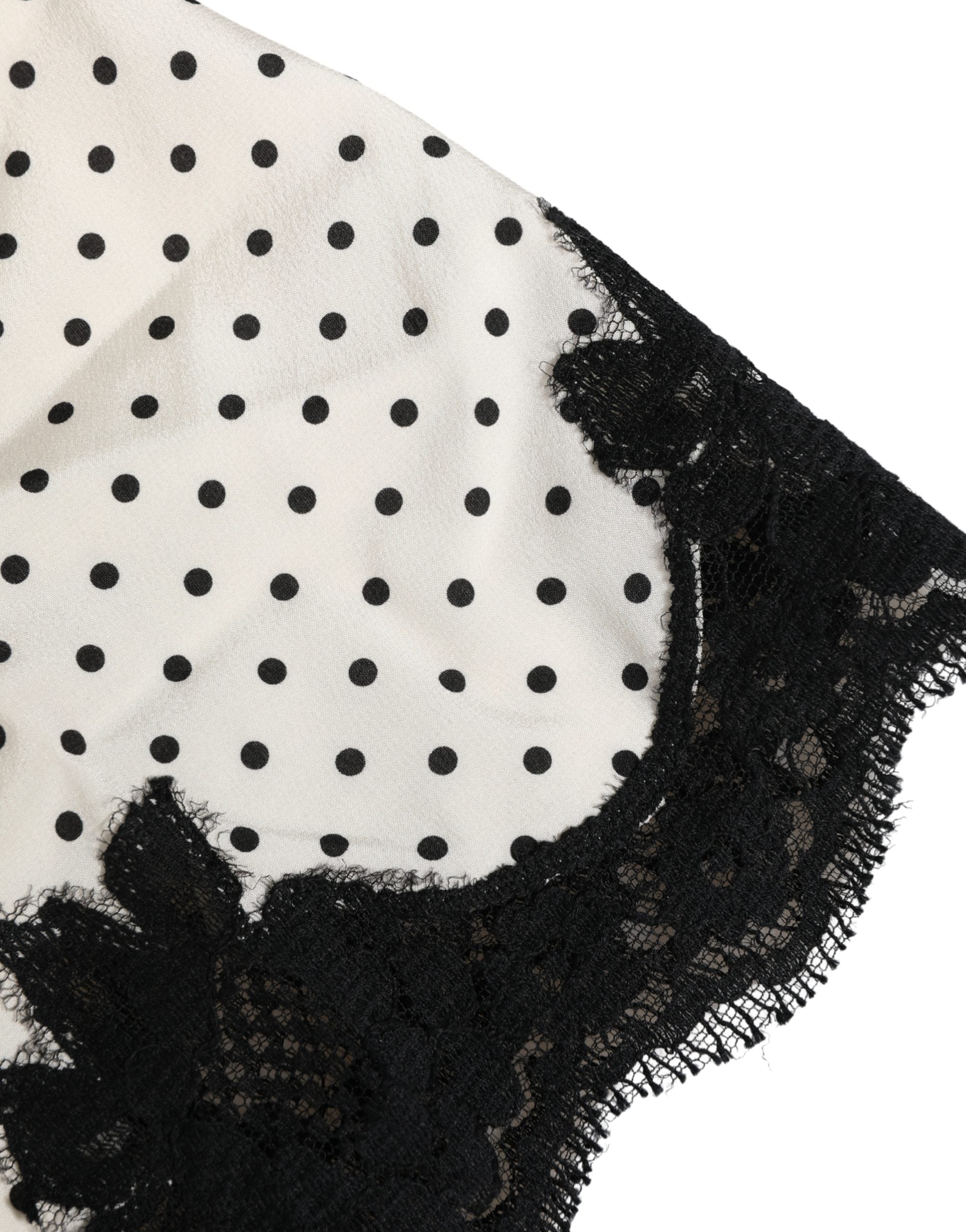 Camisole blanche Dolce & Gabbana à pois, dentelle en bordure, vêtement d'intérieur élégant et léger.