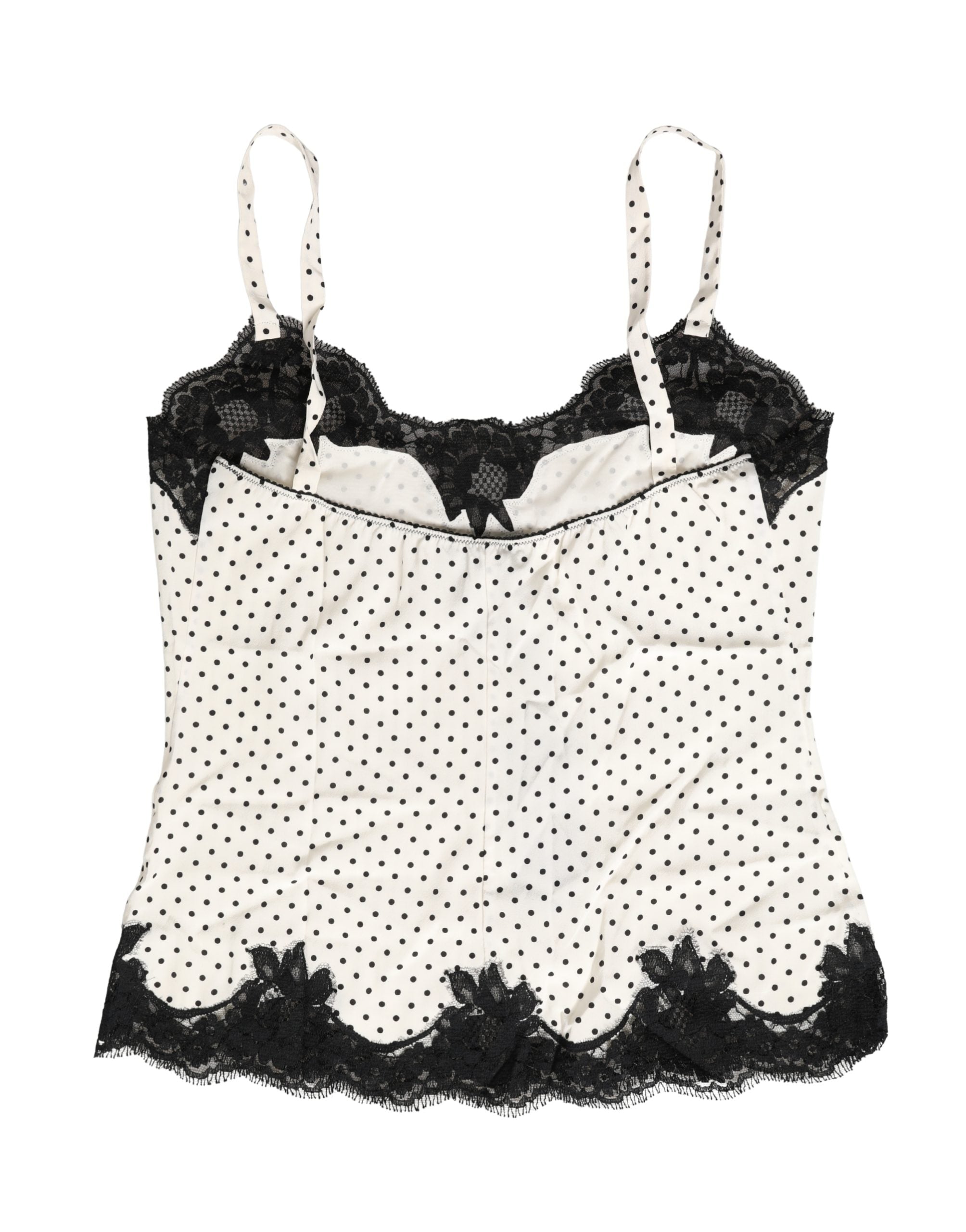 Camisole blanche Dolce & Gabbana avec pois, détails en dentelle, tissu léger, porté comme vêtement ou lingerie.