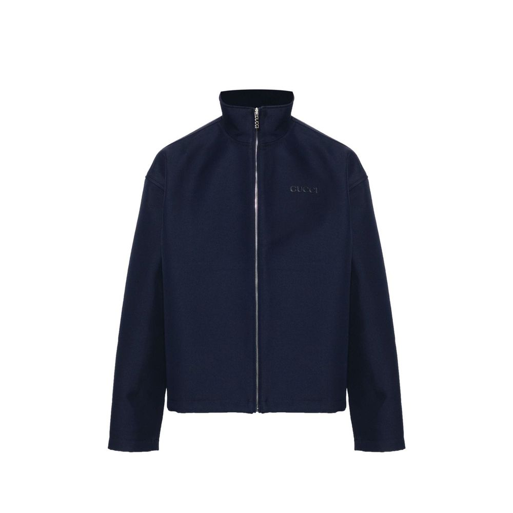 Veste longue Gucci en marabout bleu, coupe élégante et douce, avec détails raffinés visibles sur l'image.