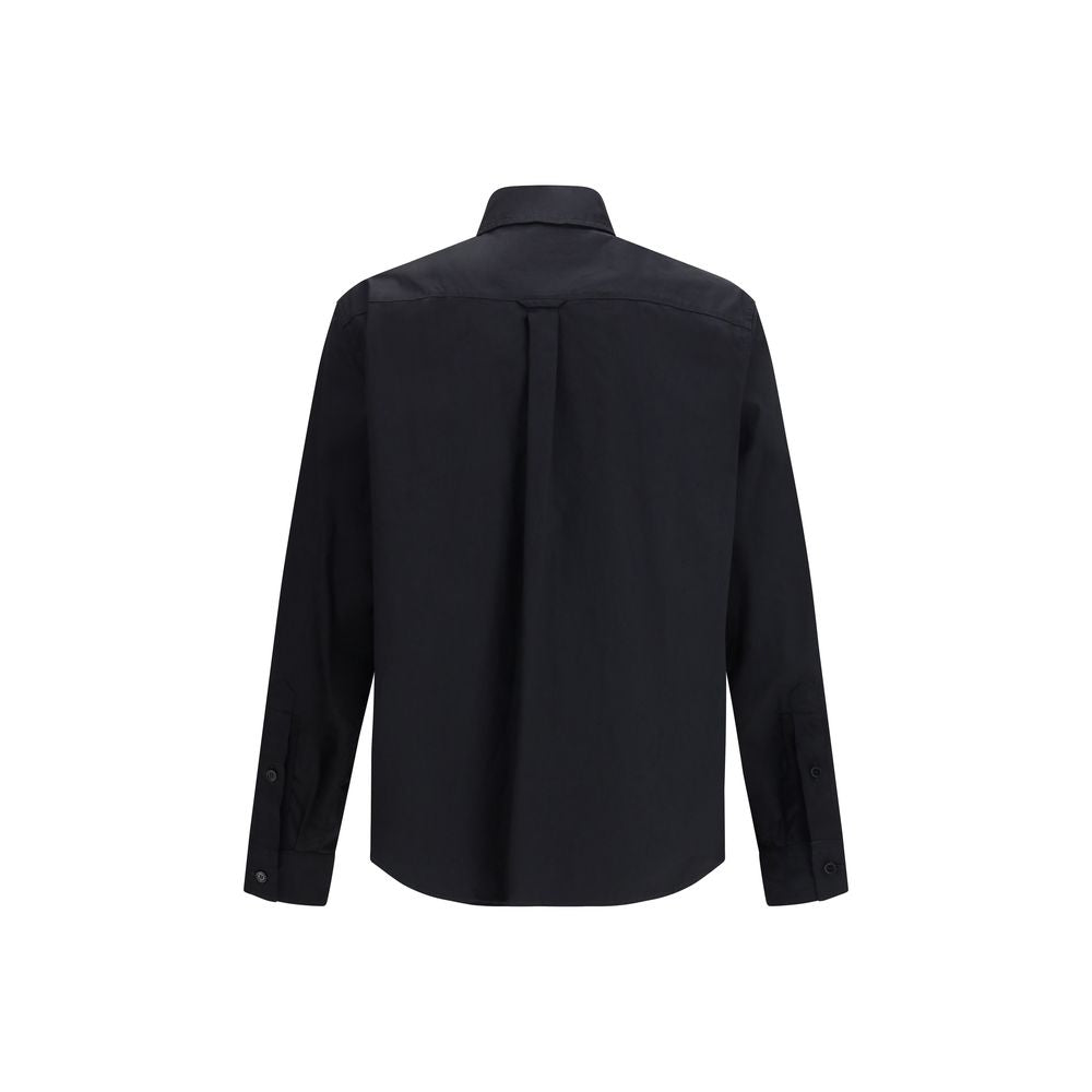 Chemise noire en coton de Dolce & Gabbana, élégante et classique, avec col et boutons visibles.