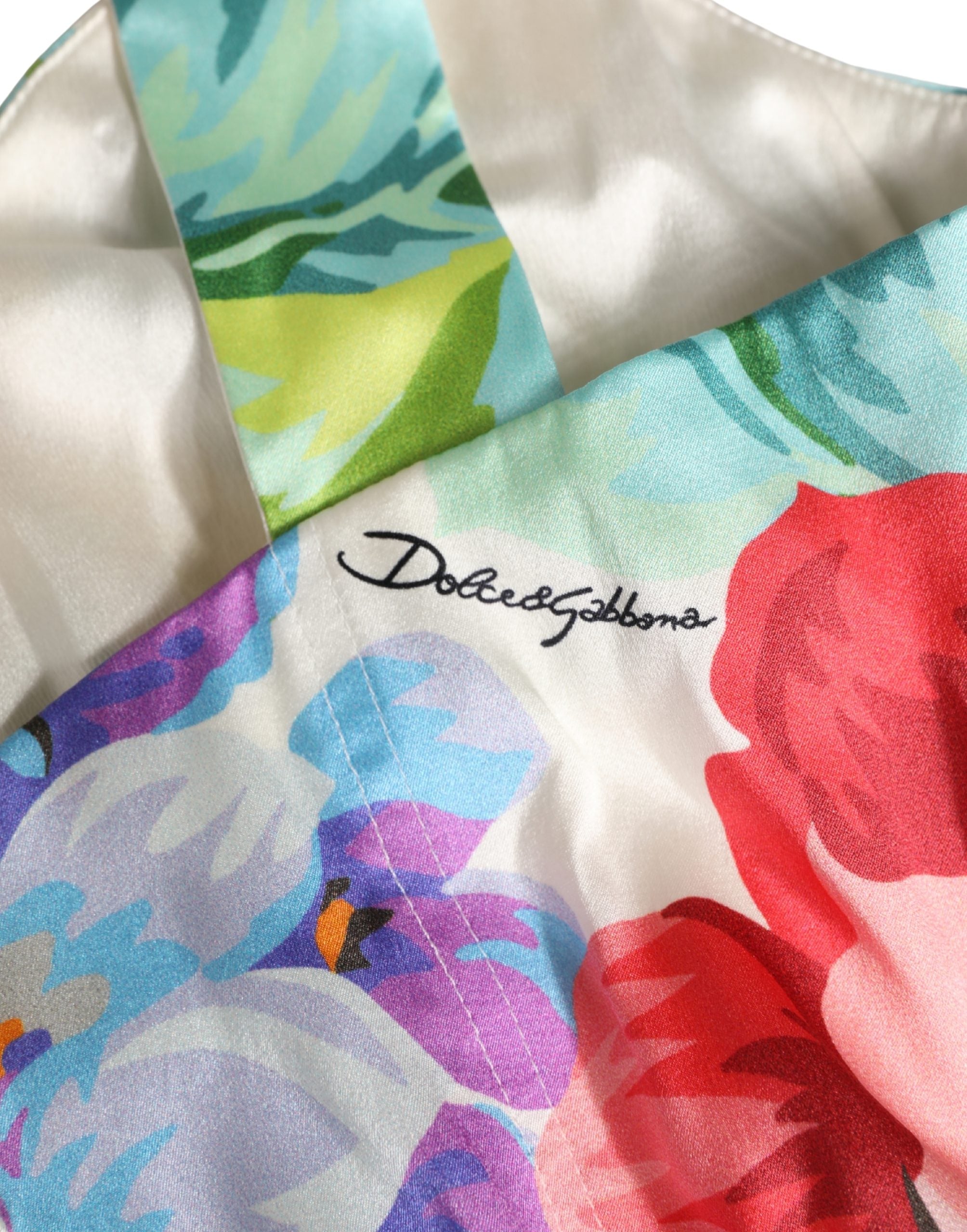 Bustier crop top en soie à motif floral multicolore de Dolce & Gabbana, avec design élégant et détails colorés.