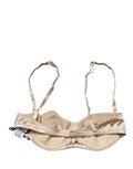 Soutien-gorge balconnet beige Dolce & Gabbana avec armatures, demi-rembourrage et design élégant visible sur l'image.