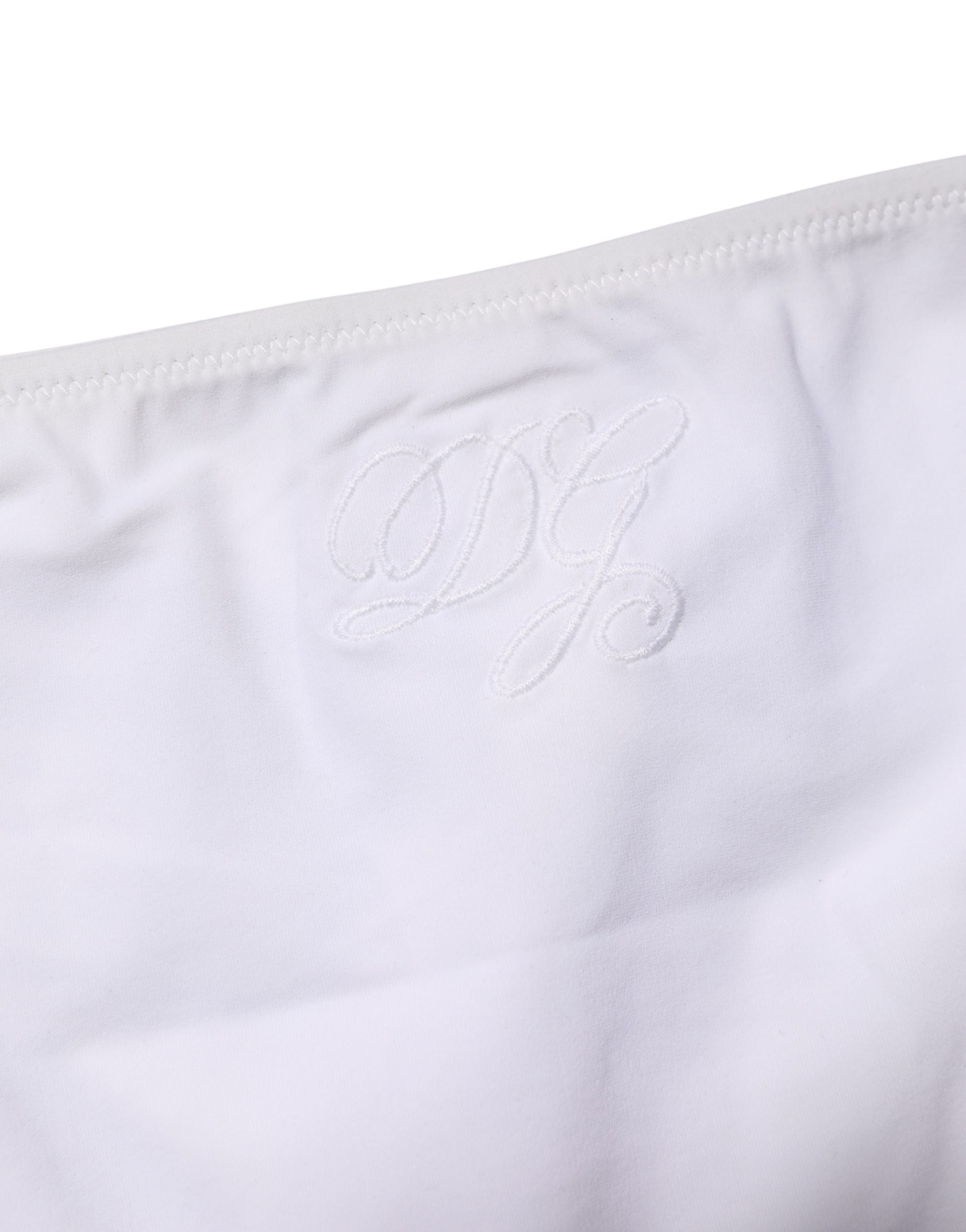 Bas de maillot de bain blanc Dolce & Gabbana avec liens sur les côtés, vêtement de plage élégant et tendance pour femme.