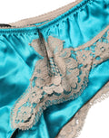 Culotte Dolce & Gabbana en satin de soie bleu avec dentelle florale, sous-vêtements élégants et raffinés.