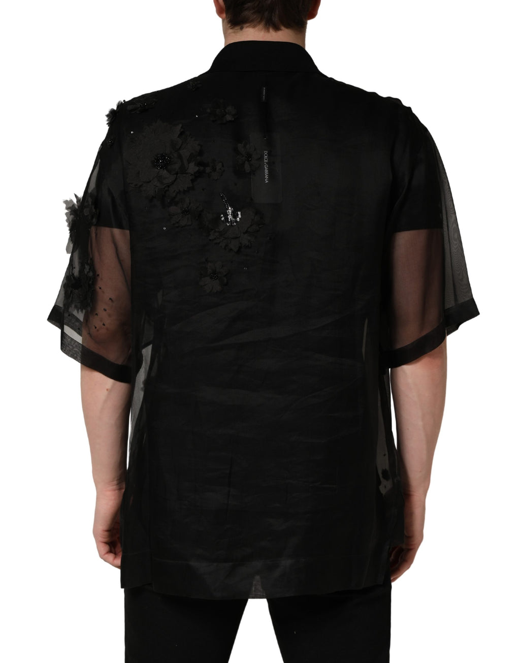 Chemise courte en tulle noire Dolce & Gabbana avec appliqué floral transparent et manches courtes élégantes.
