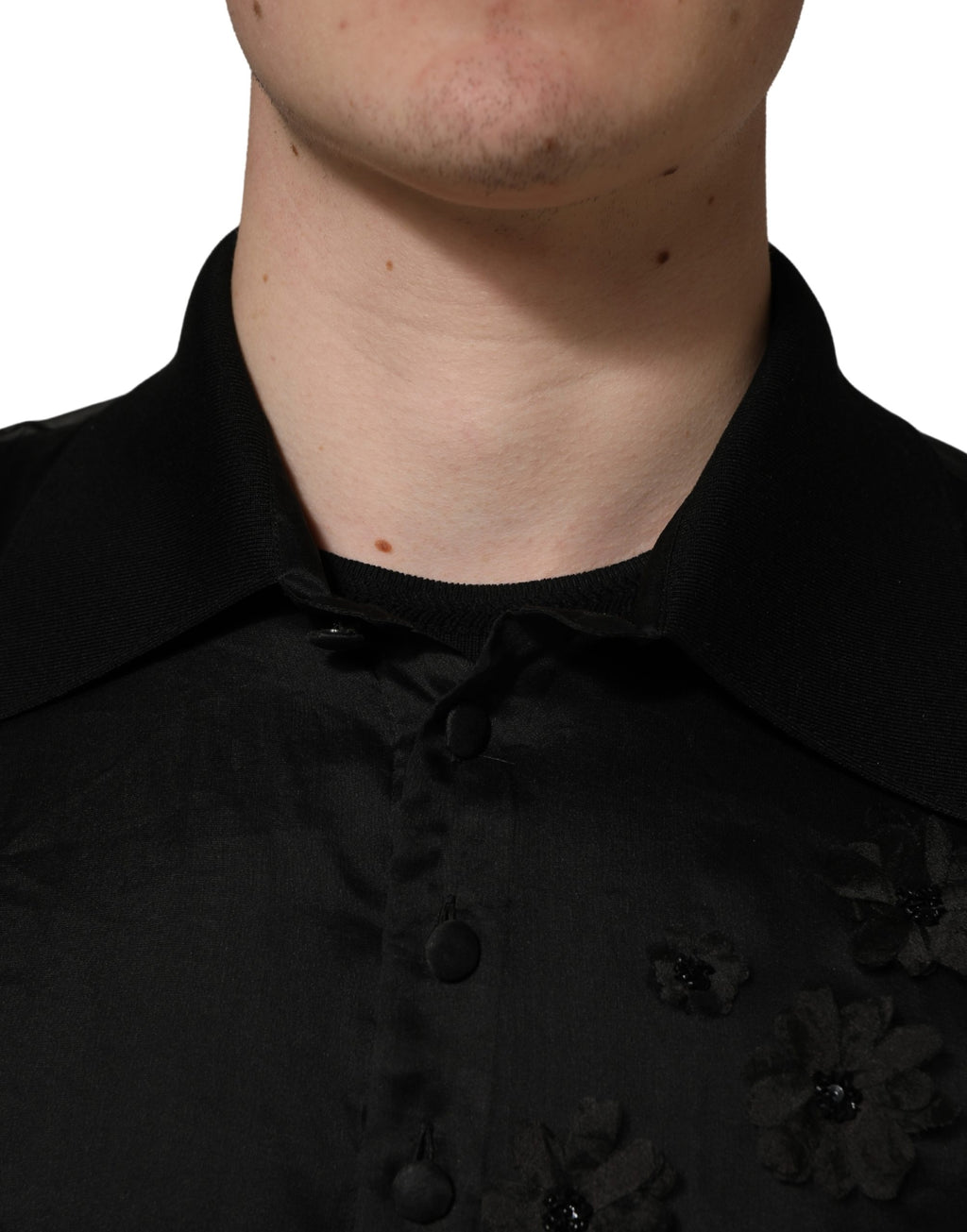 Chemise courte en dentelle transparente noire avec broderie florale Dolce & Gabbana, manches courtes et appliqués floraux élégants.
