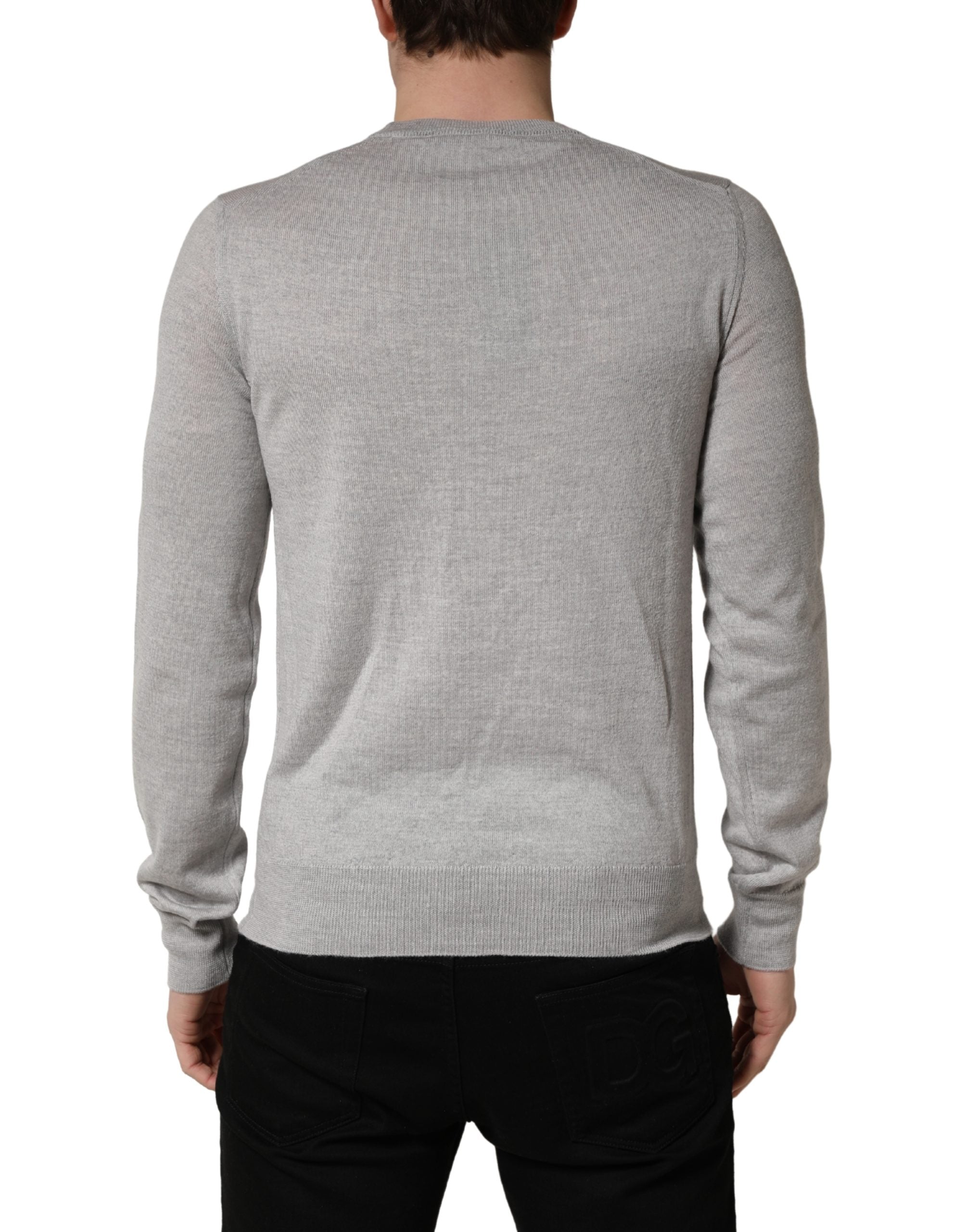 Pull doux Dolce & Gabbana gris à manches longues et col rond, élégant pull-over en laine pour femme.