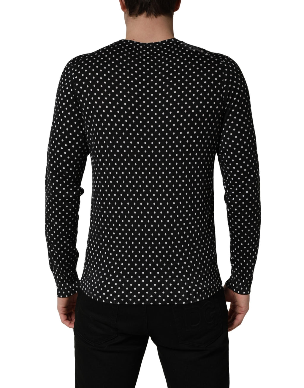 Pull Dolce & Gabbana noir à pois blancs, col rond, sweat-shirt en laine avec motif à pois, vue de face.