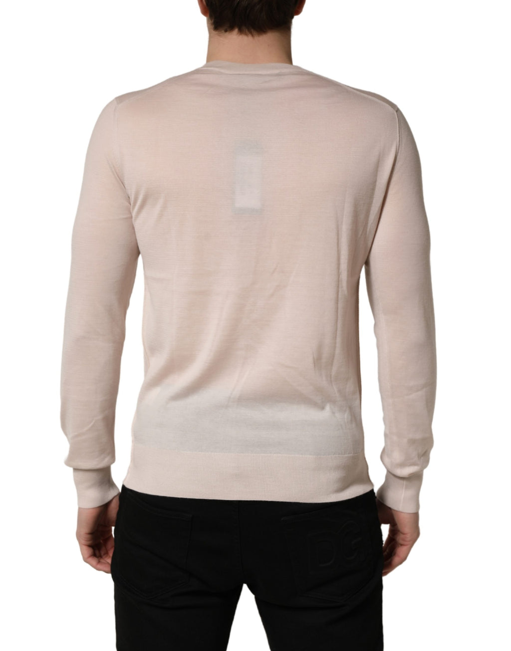 Pull en cachemire beige Dolce & Gabbana pour homme avec col en V, doux et élégant, visible en détail dans l’image.