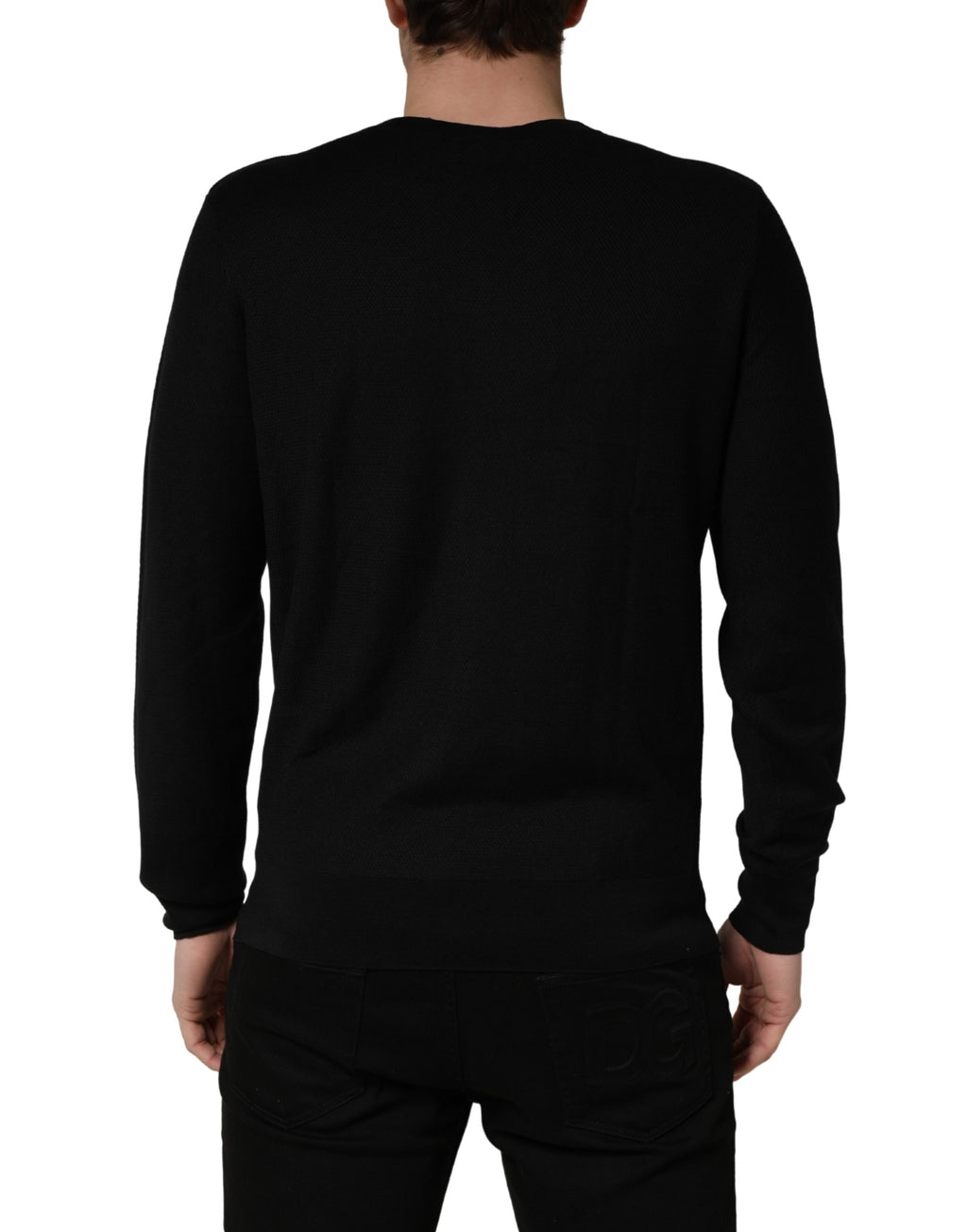 Pull en laine à col rond noir Dolce & Gabbana, manches longues, style élégant et moderne.