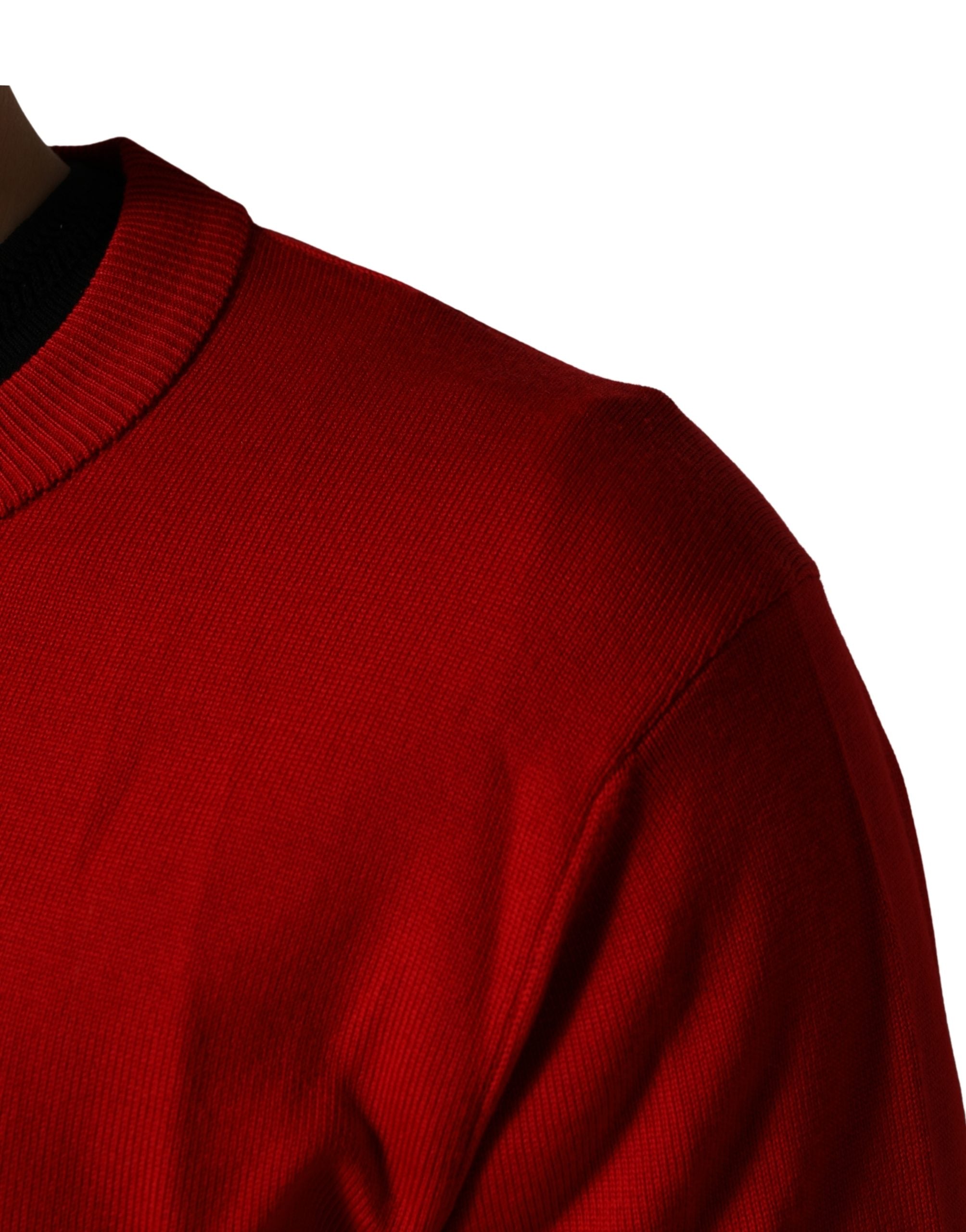Pull à manches longues Dolce & Gabbana rouge avec motif œil imprimé, col rond, style décontracté.