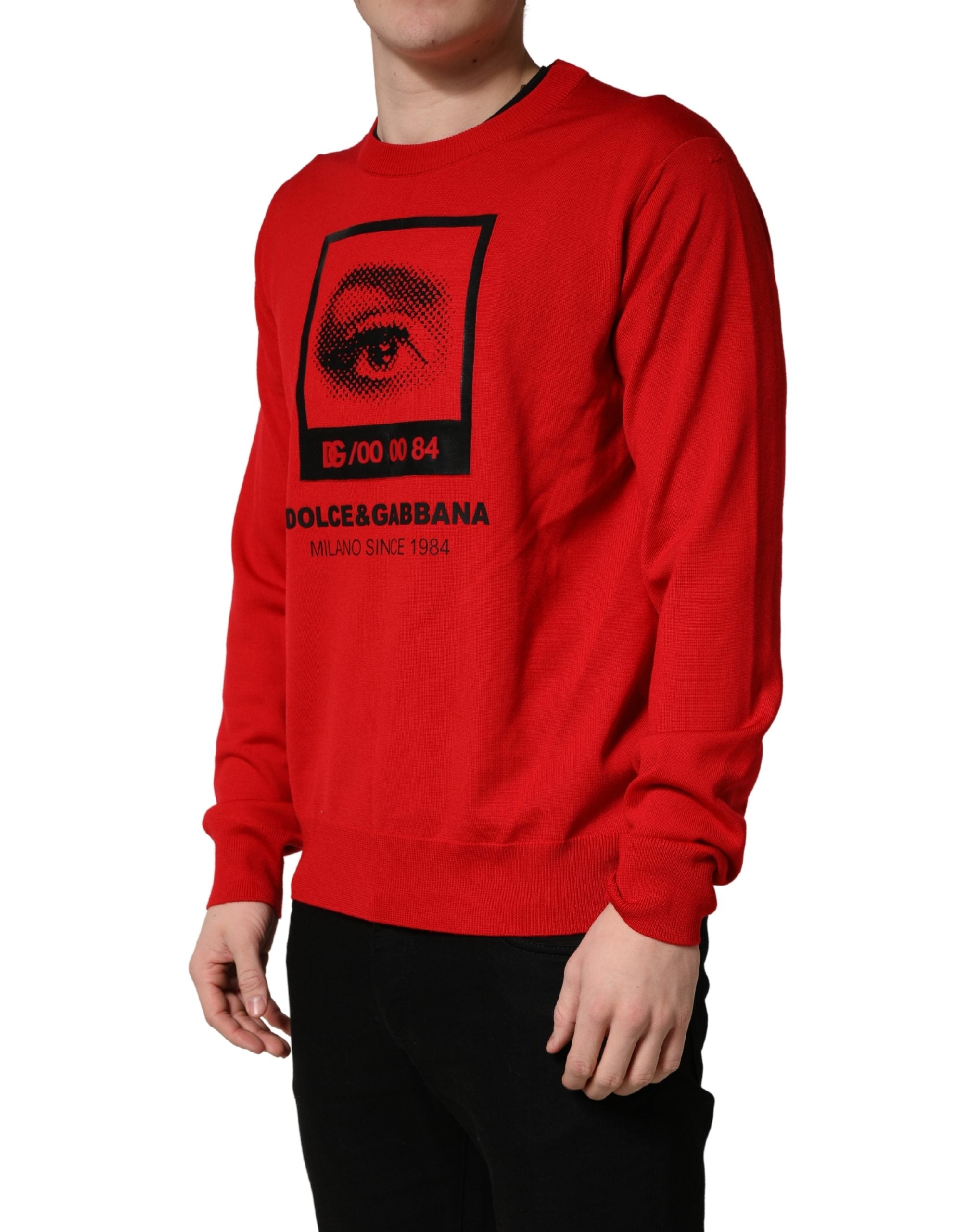 Pull en molleton rouge Dolce & Gabbana avec motif œil imprimé, col rond, style décontracté et tendance.