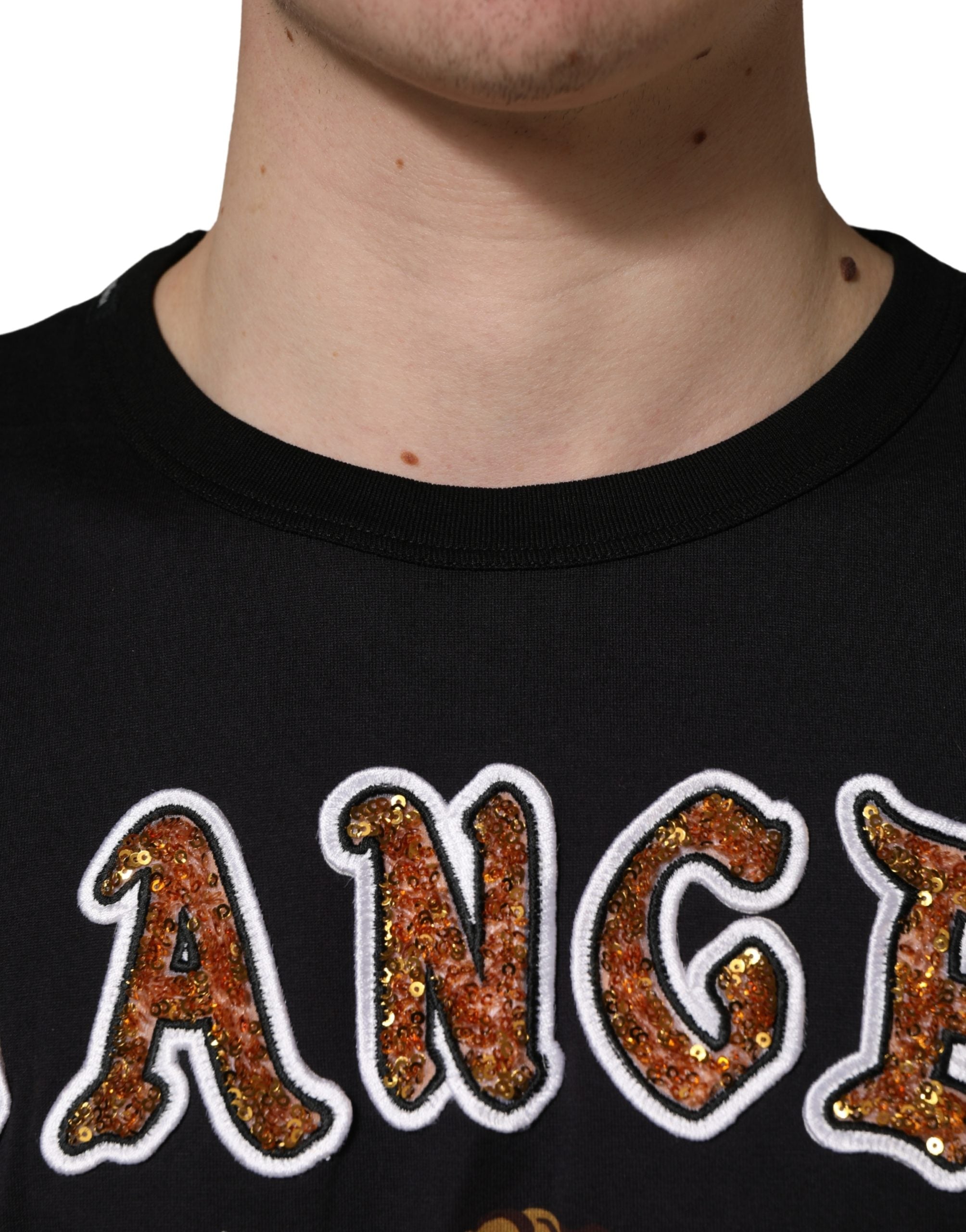 T-shirt en coton noir Dolce & Gabbana avec imprimé d'ange et col ras du cou, détail de style élégant et artistique.