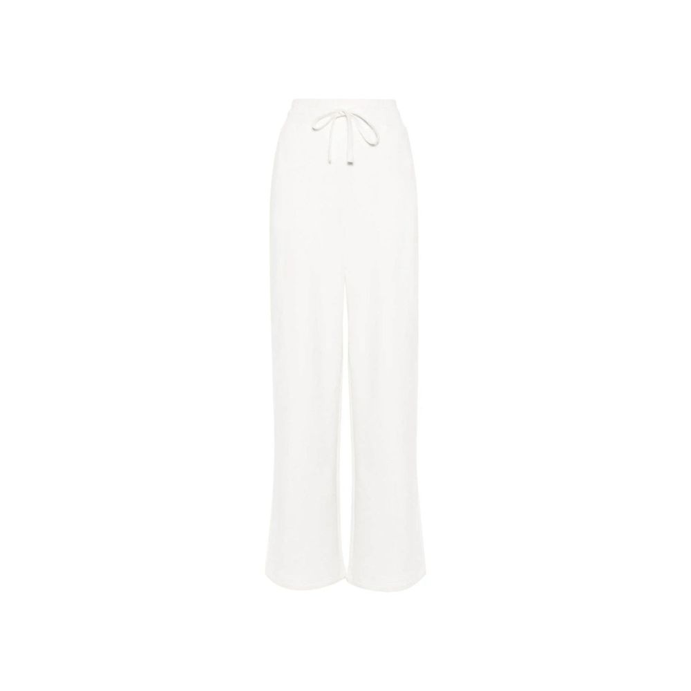 Pantalons de jogging en coton blanc Gucci, style décontracté pour l'entraînement, avec logo Gucci visible sur la jambe.