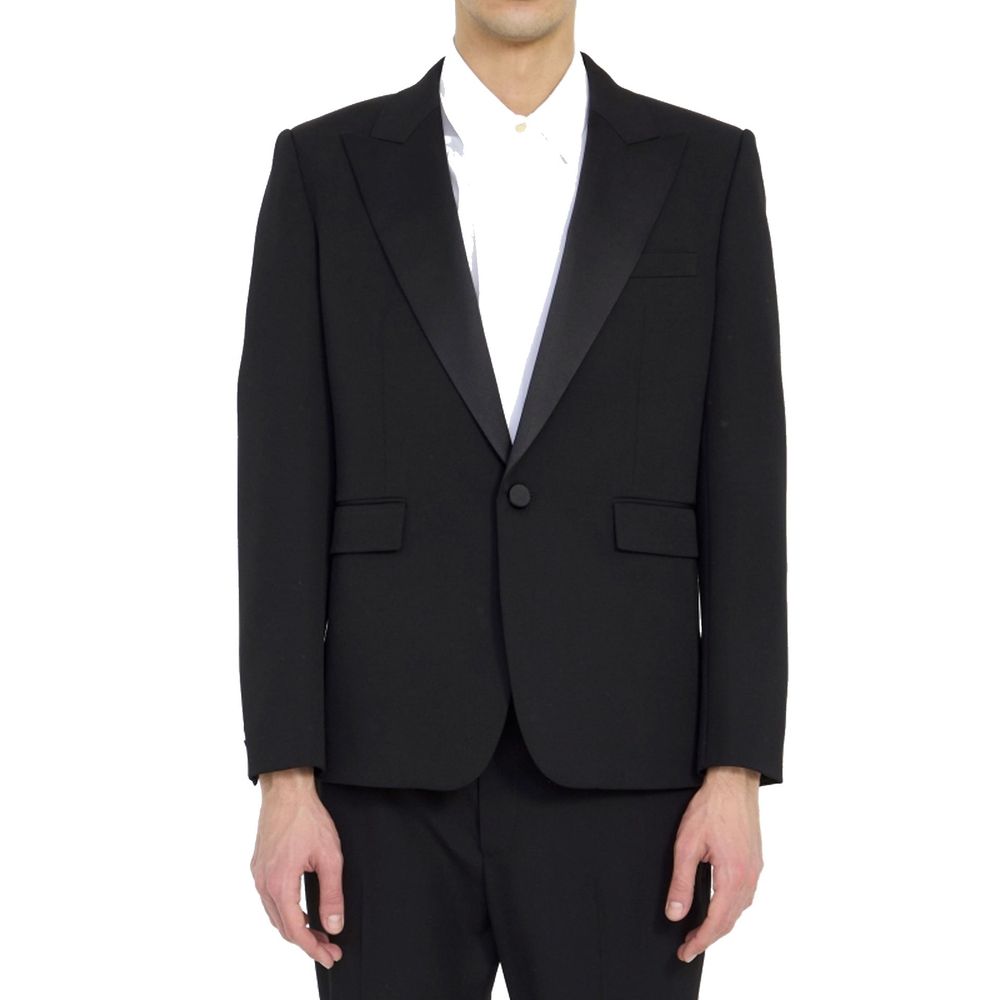 Blazer en laine noire Saint Laurent, coupe élégante, porté sur un mannequin, détail des boutons et finition soignée visible.