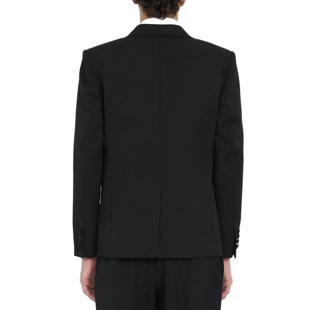 Veste en laine noire Saint Laurent, blazer élégant avec coupe classique, détails sophistiqués et finition soignée visible en image.
