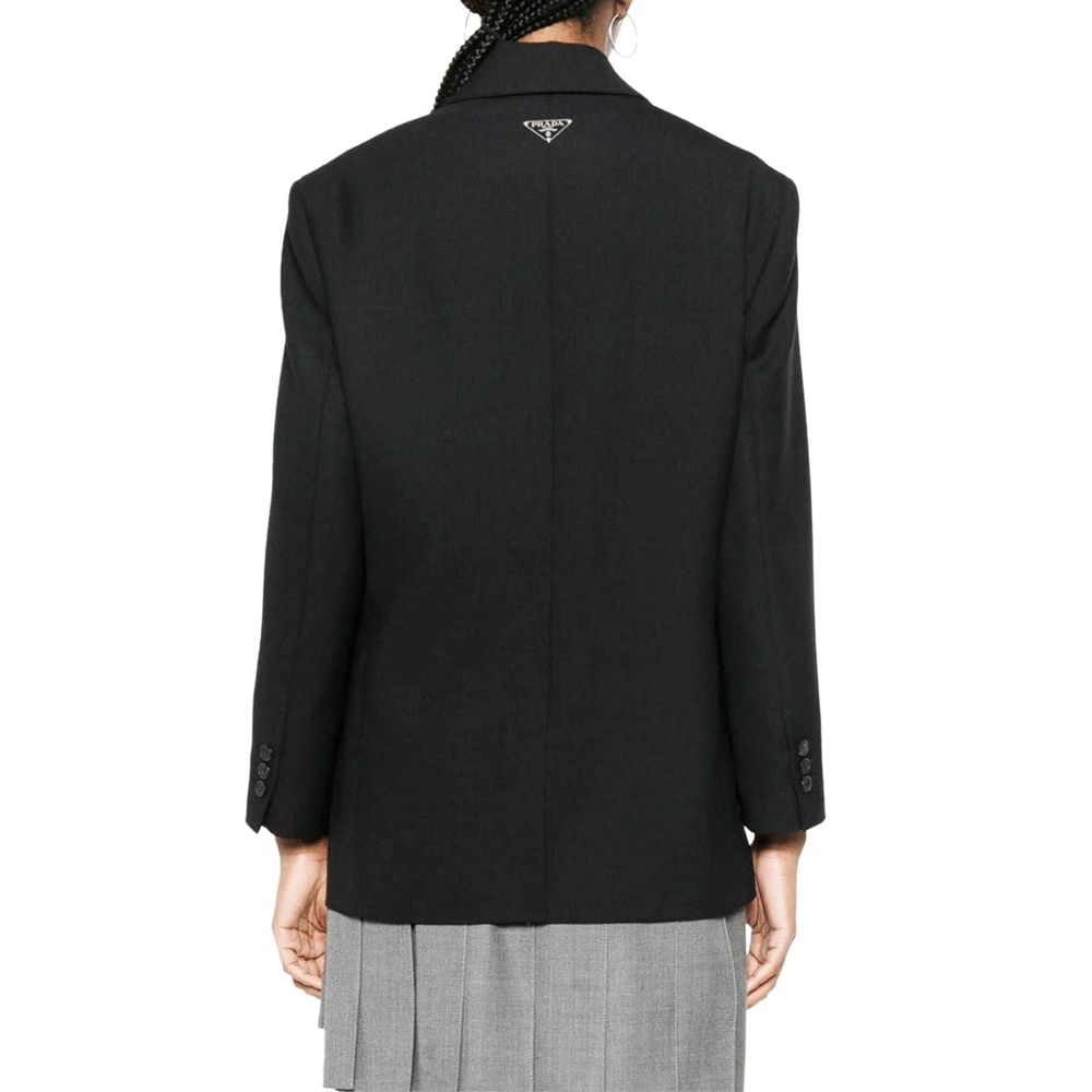Veste blazer en laine vierge noire de Prada, élégante et structurée, vue de face avec détails de couture visibles.