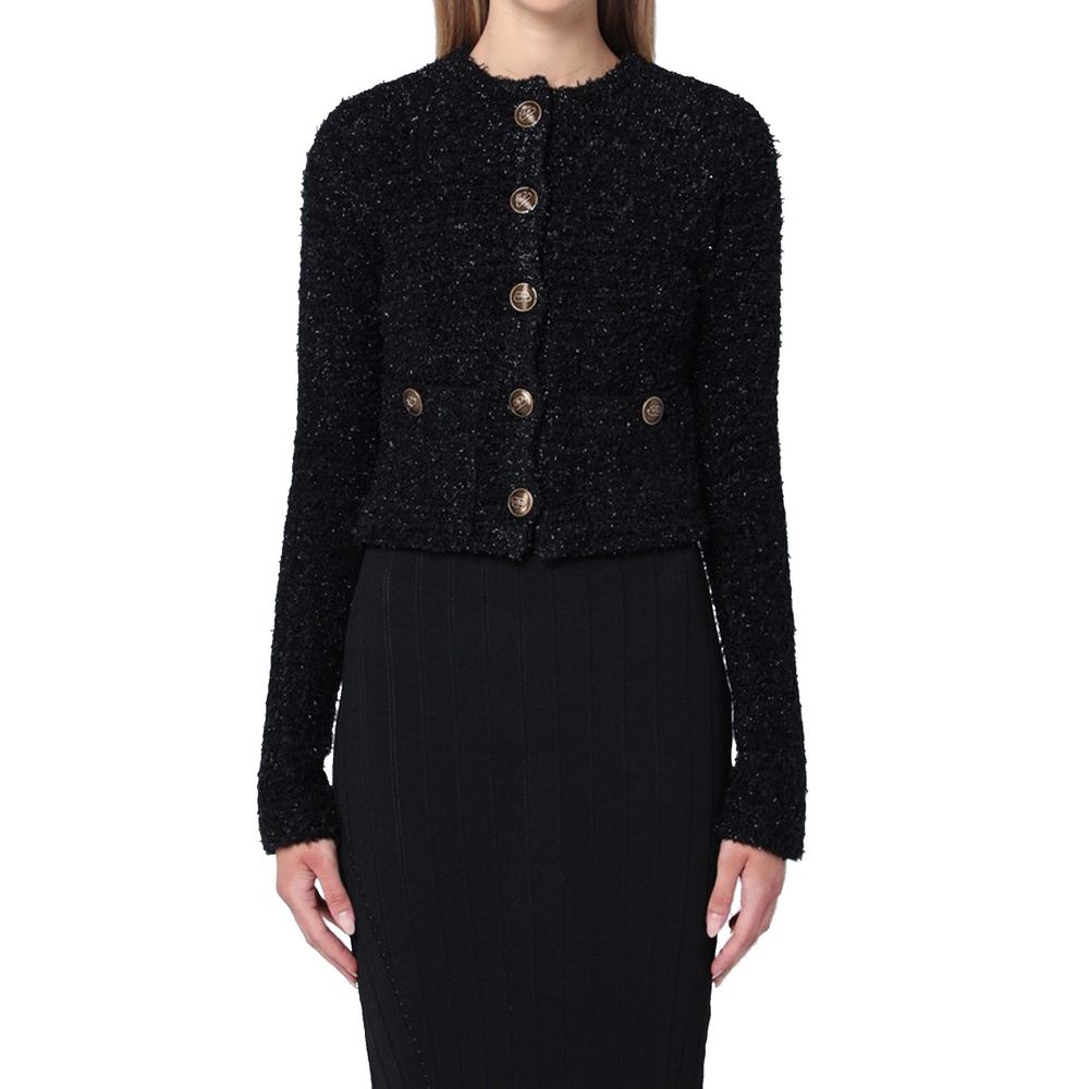 Cardigan noir en coton de la marque Balenciaga, coupe élégante et détails modernes, porté ou posé sur un fond neutre.