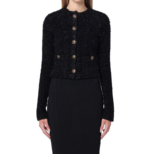 Cardigan noir en coton de la marque Balenciaga, coupe élégante et détails modernes, porté ou posé sur un fond neutre.
