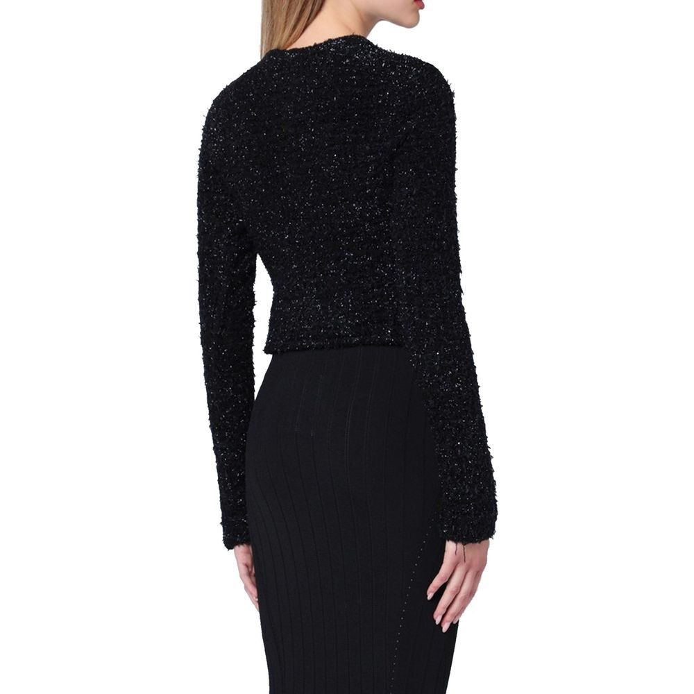 Cardigan noir en coton de la marque Balenciaga, avec détails de couture élégants et coupe classique.