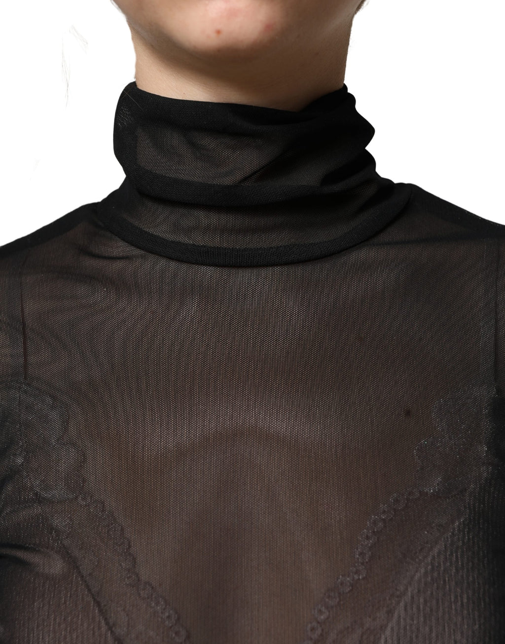 Combinaison noire en nylon transparent Dolce & Gabbana à col roulé, élégante et ajustée, portée par un mannequin.