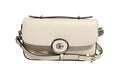 Sac à épaule Gucci Petite GG Flap avec logo emblématique en cuir matelassé et chaîne dorée, vue de face.