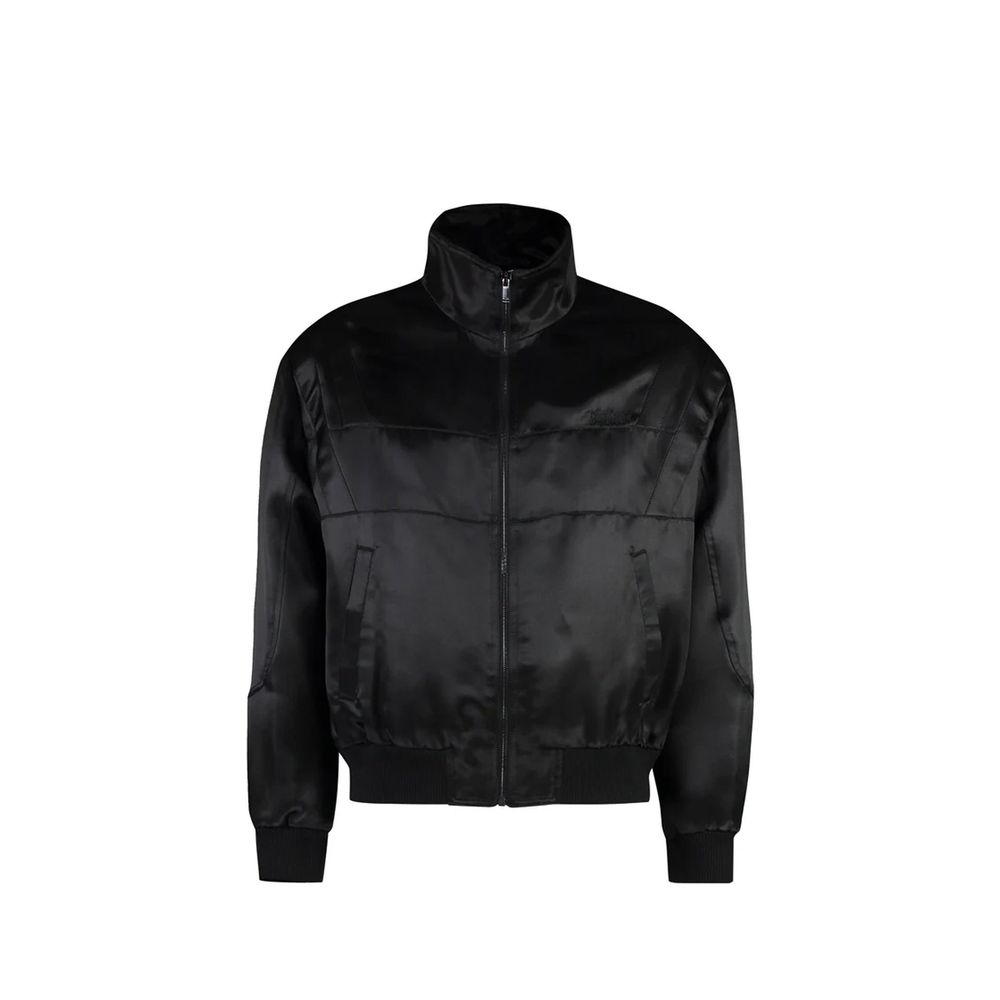 Veste en soie noire Saint Laurent, élégante et raffinée, avec coupe classique et détails sophistiqués visible sur l'image.