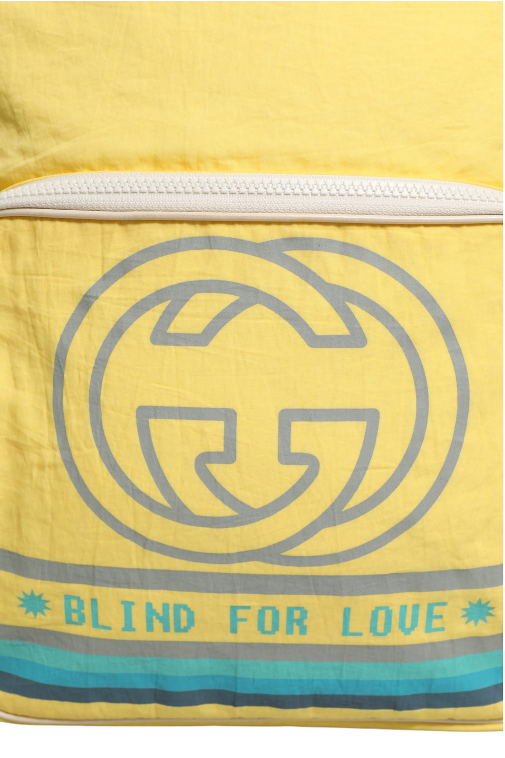 Sac à dos Gucci Blind For Love en nylon jaune avec logo Gucci visible, style élégant et moderne.