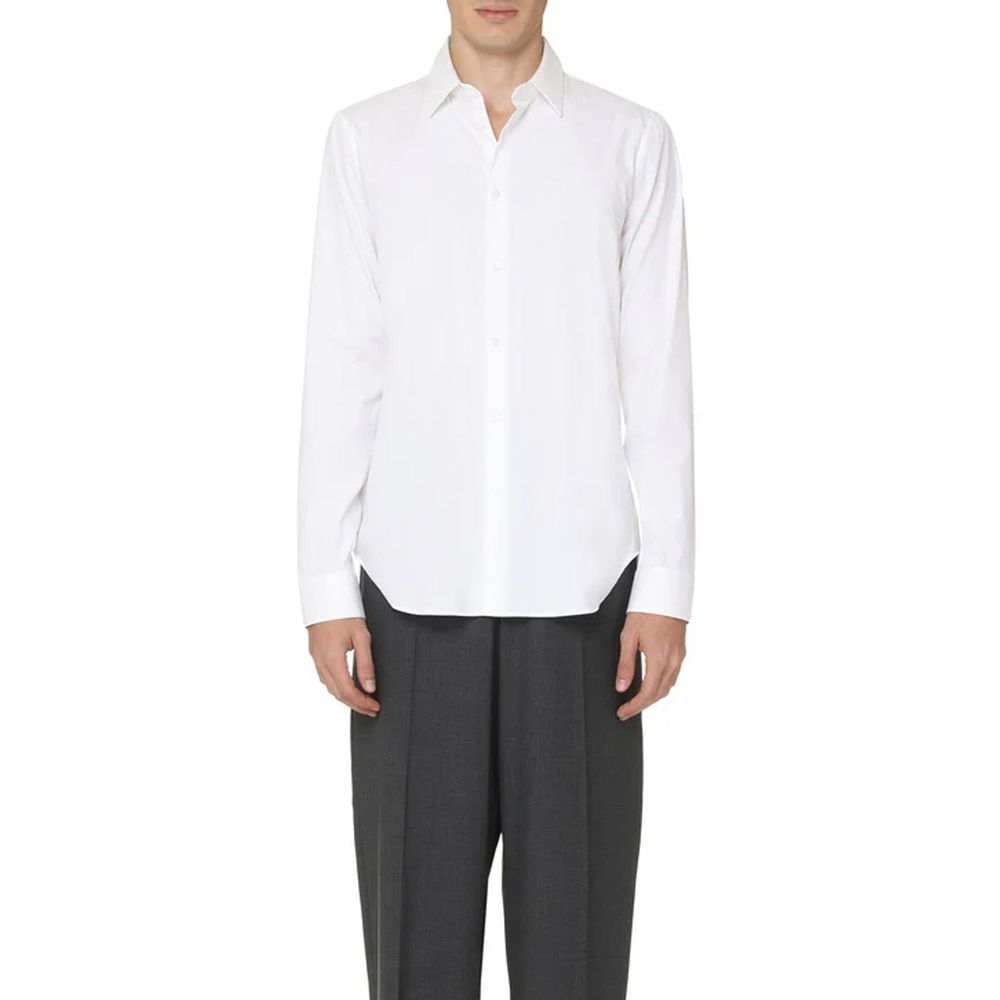 Chemise blanche en coton de la marque Gucci, col classique et boutons visibles, pour un style élégant et sophistiqué.