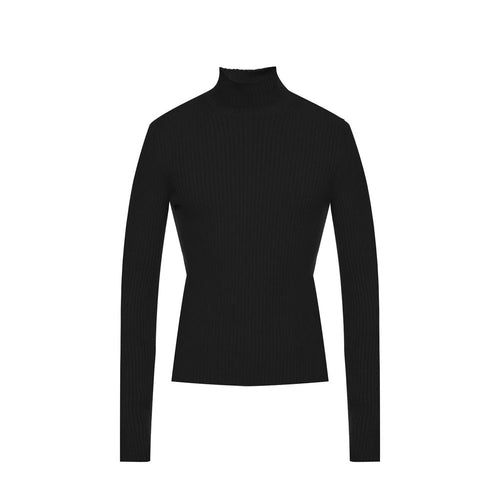Pull en cachemire noir Balenciaga avec col roulé, doux et élégant, porté sur un mannequin.