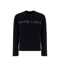 Sweatshirt noir en coton de la marque Givenchy, coupe décontractée, avec logo discrètement visible, porté en style casual.