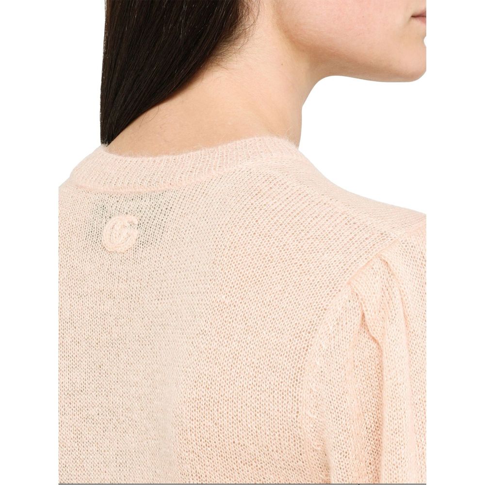 Sweat-shirt en laine multicolore de Gucci, coupe décontractée et détails colorés, porté sur un mannequin.