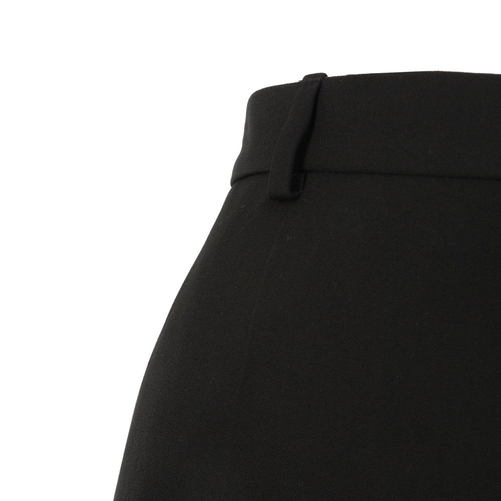 Pantalon évasé en laine noire de Balenciaga, style tendance, avec une coupe fluide et moderne.