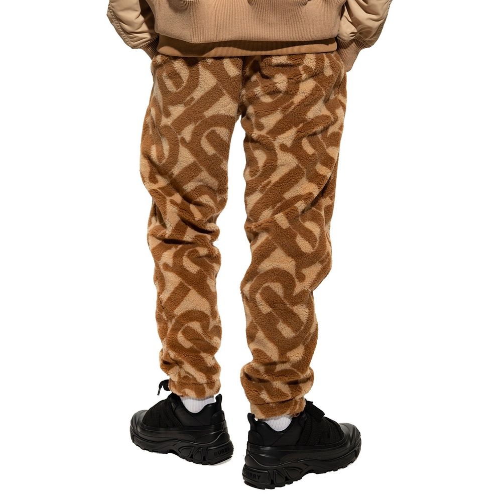 Pantalon casual en polyester marron de la marque Burberry, coupe décontractée, avec ceinture et détails élégants.