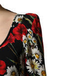 Robe longue en soie noire à fleurs Dolce & Gabbana avec manches longues, élégante et sophistiquée, portée sur un mannequin.