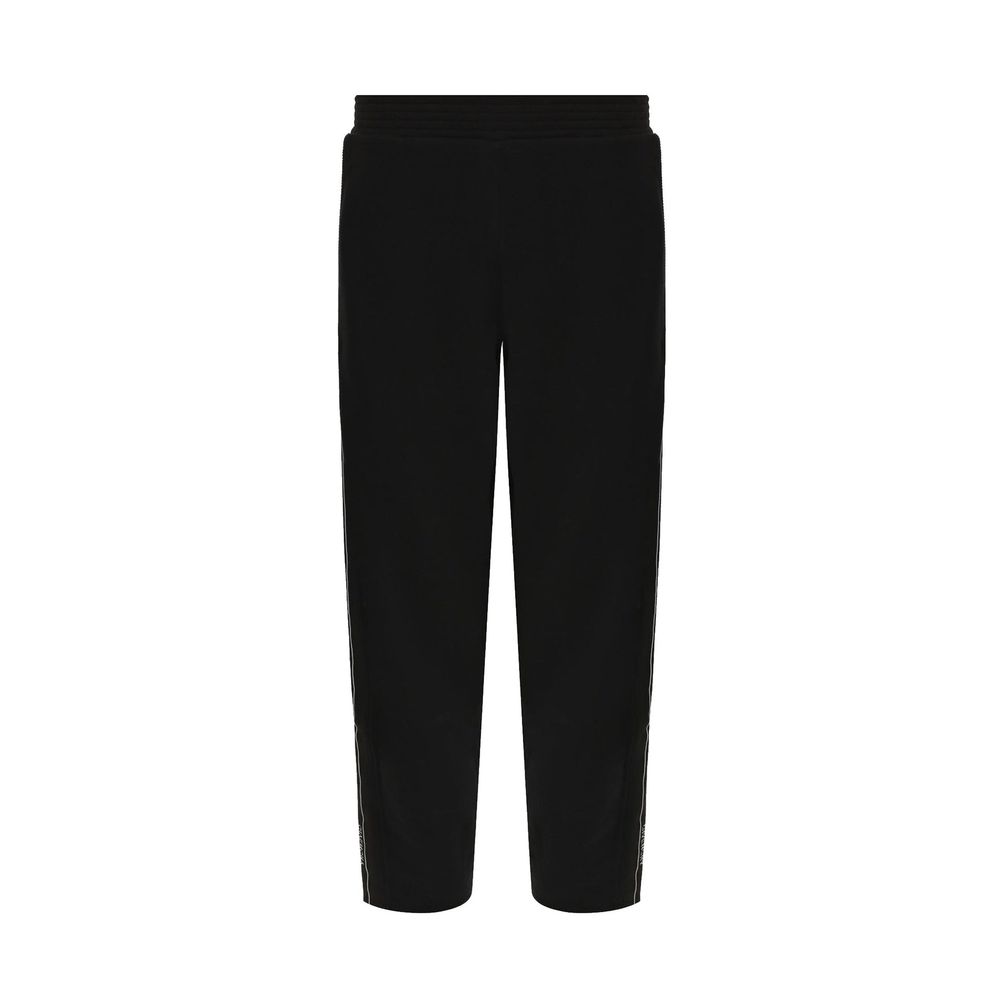 Pantalons de jogging noirs en coton Givenchy pour homme, style décontracté et confortable, visibles sur le produit.