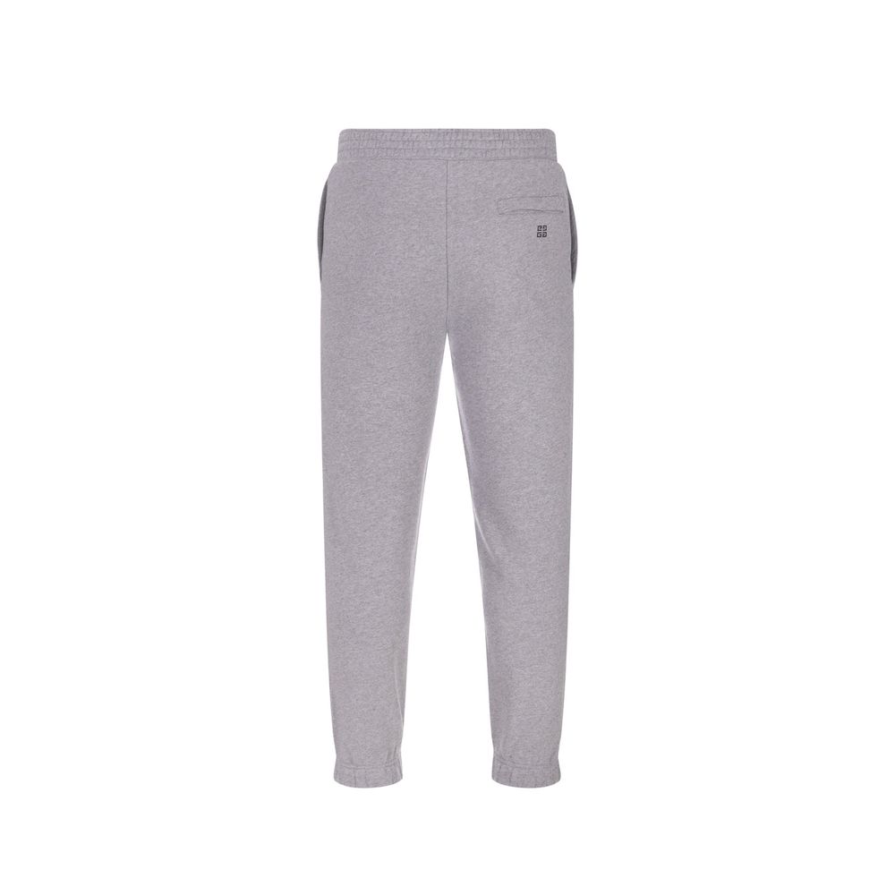 Pantalons de jogging gris en coton Givenchy pour homme, style décontracté et confortable pour l'entraînement ou la détente.